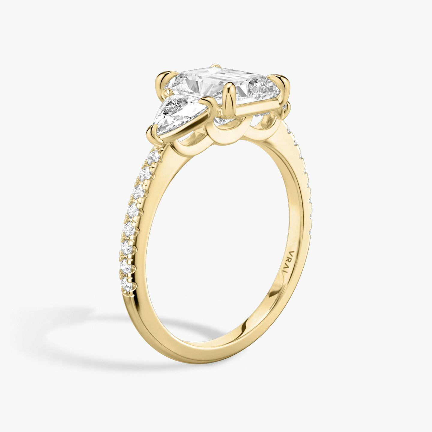 The Three Stone | Radiant | 18k | 18k Yellow Gold | Band: Pavé | Side stone carat: 1/4 | Side stone shape: Trillion | Diamond orientation: vertical | Carat weight: See full inventory