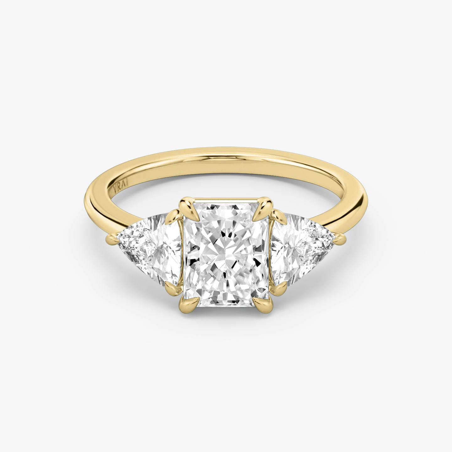 The Three Stone | Radiant | 18k | 18k Yellow Gold | Band: Plain | Side stone carat: 1/2 | Side stone shape: Trillion | Diamond orientation: vertical | Carat weight: See full inventory
