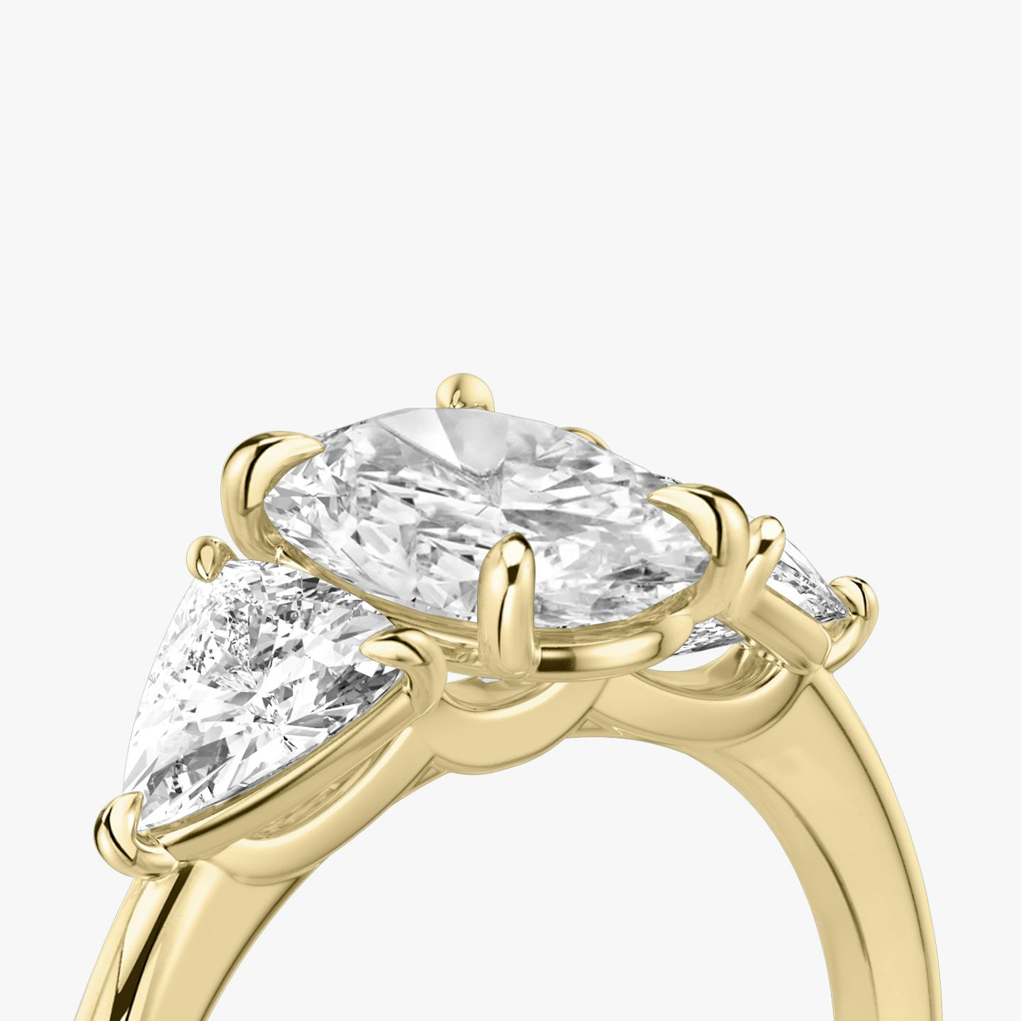 The Three Stone | Oval | 18k | 18k Yellow Gold | Band: Plain | Side stone carat: 1/2 | Side stone shape: Trillion | Diamond orientation: vertical | Carat weight: See full inventory