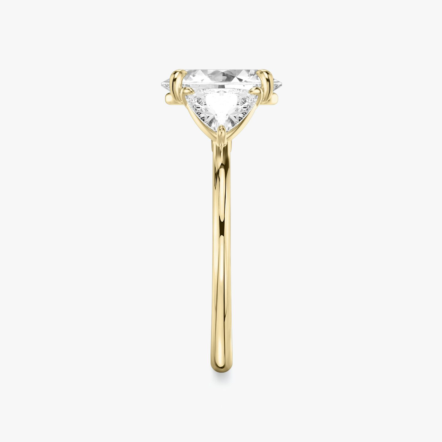 The Three Stone | Oval | 18k | 18k Yellow Gold | Band: Plain | Side stone carat: 1/2 | Side stone shape: Trillion | Diamond orientation: vertical | Carat weight: See full inventory