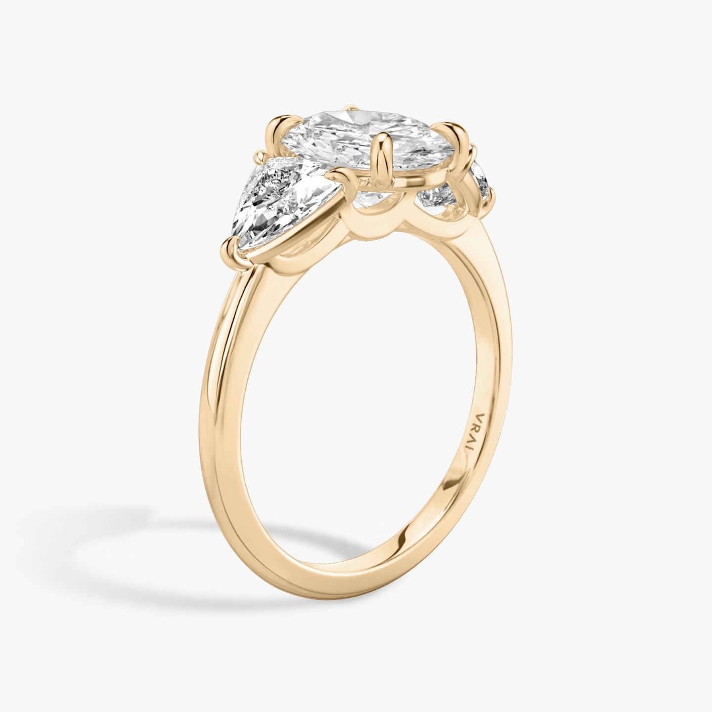 The Three Stone | Oval | 14k | 14k Rose Gold | Band: Plain | Side stone carat: 1/2 | Side stone shape: Trillion | Diamond orientation: vertical | Carat weight: See full inventory