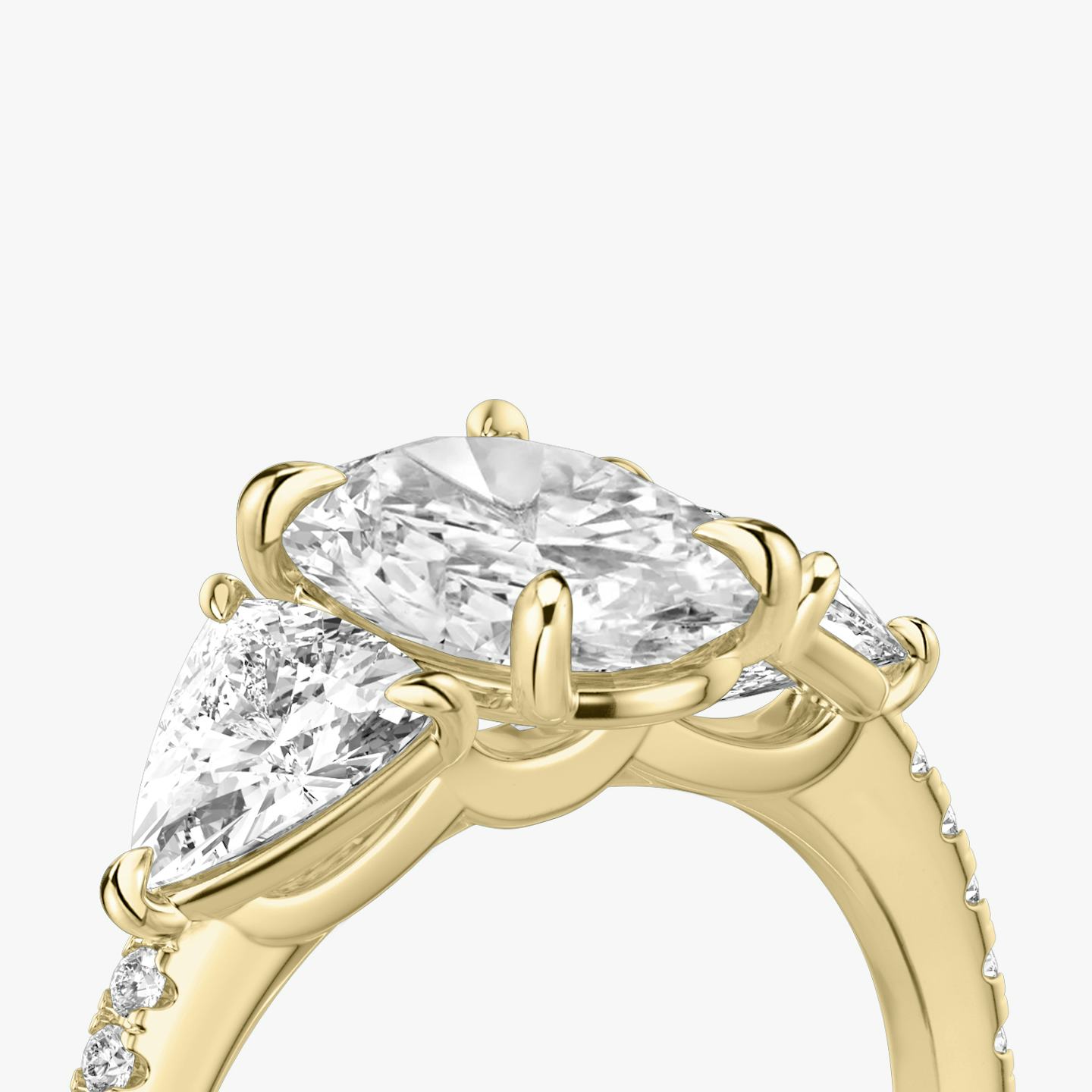 The Three Stone | Oval | 18k | 18k Yellow Gold | Band: Pavé | Side stone carat: 1/2 | Side stone shape: Trillion | Diamond orientation: vertical | Carat weight: See full inventory