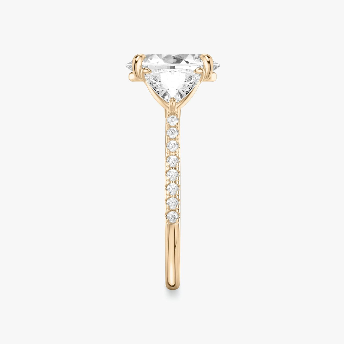 The Three Stone | Oval | 14k | 14k Rose Gold | Band: Pavé | Side stone carat: 1/2 | Side stone shape: Trillion | Diamond orientation: vertical | Carat weight: See full inventory