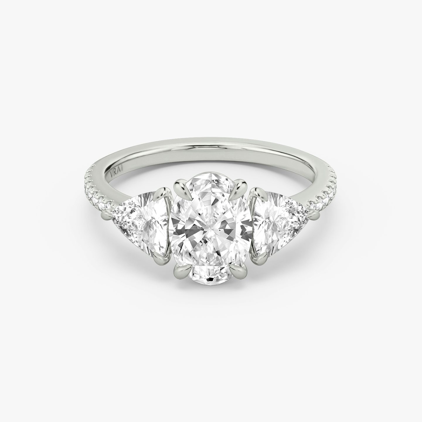 The Three Stone | Oval | Platinum | Band: Pavé | Side stone carat: 1/2 | Side stone shape: Trillion | Diamond orientation: vertical | Carat weight: See full inventory