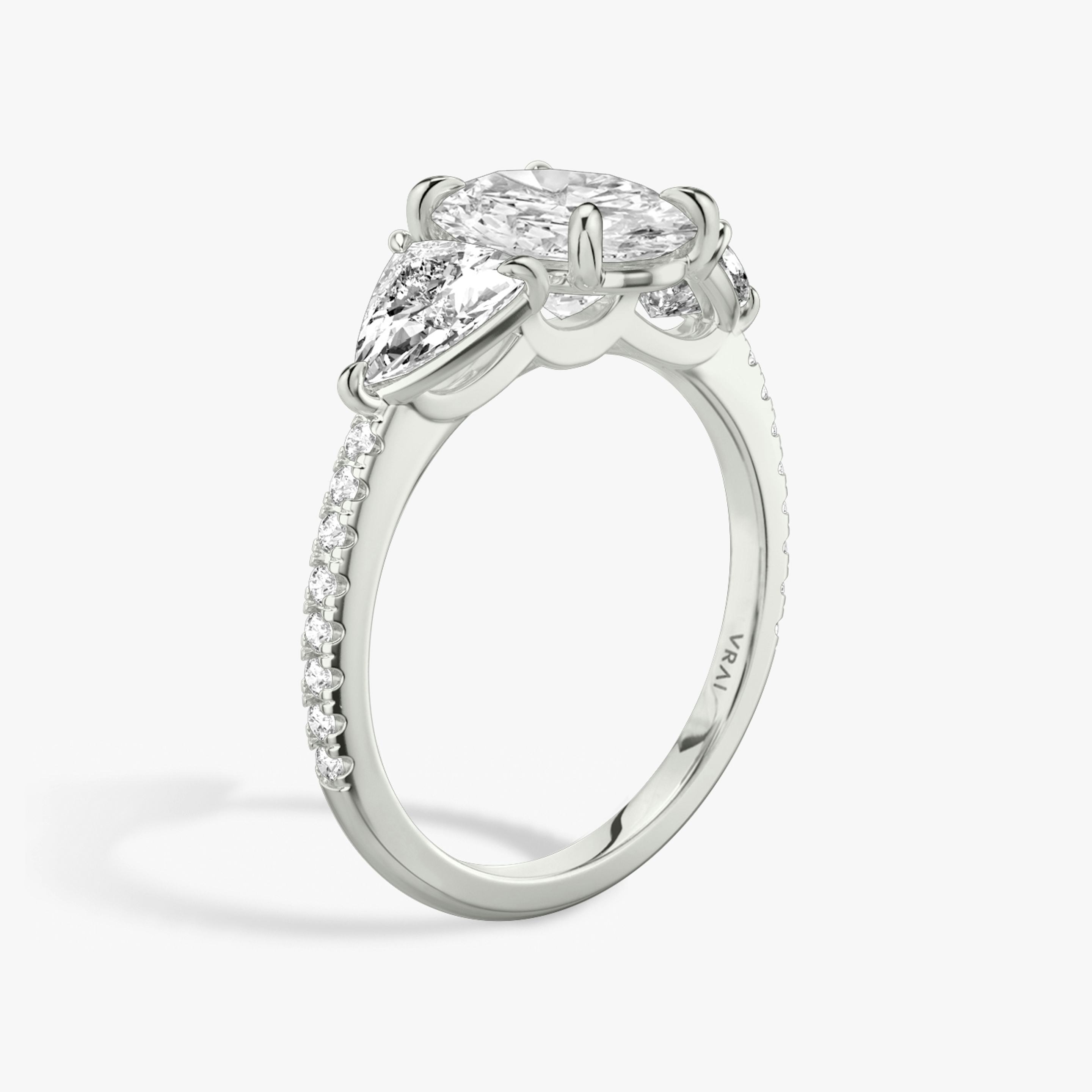 The Three Stone | Oval | Platinum | Band: Pavé | Side stone carat: 1/2 | Side stone shape: Trillion | Diamond orientation: vertical | Carat weight: See full inventory