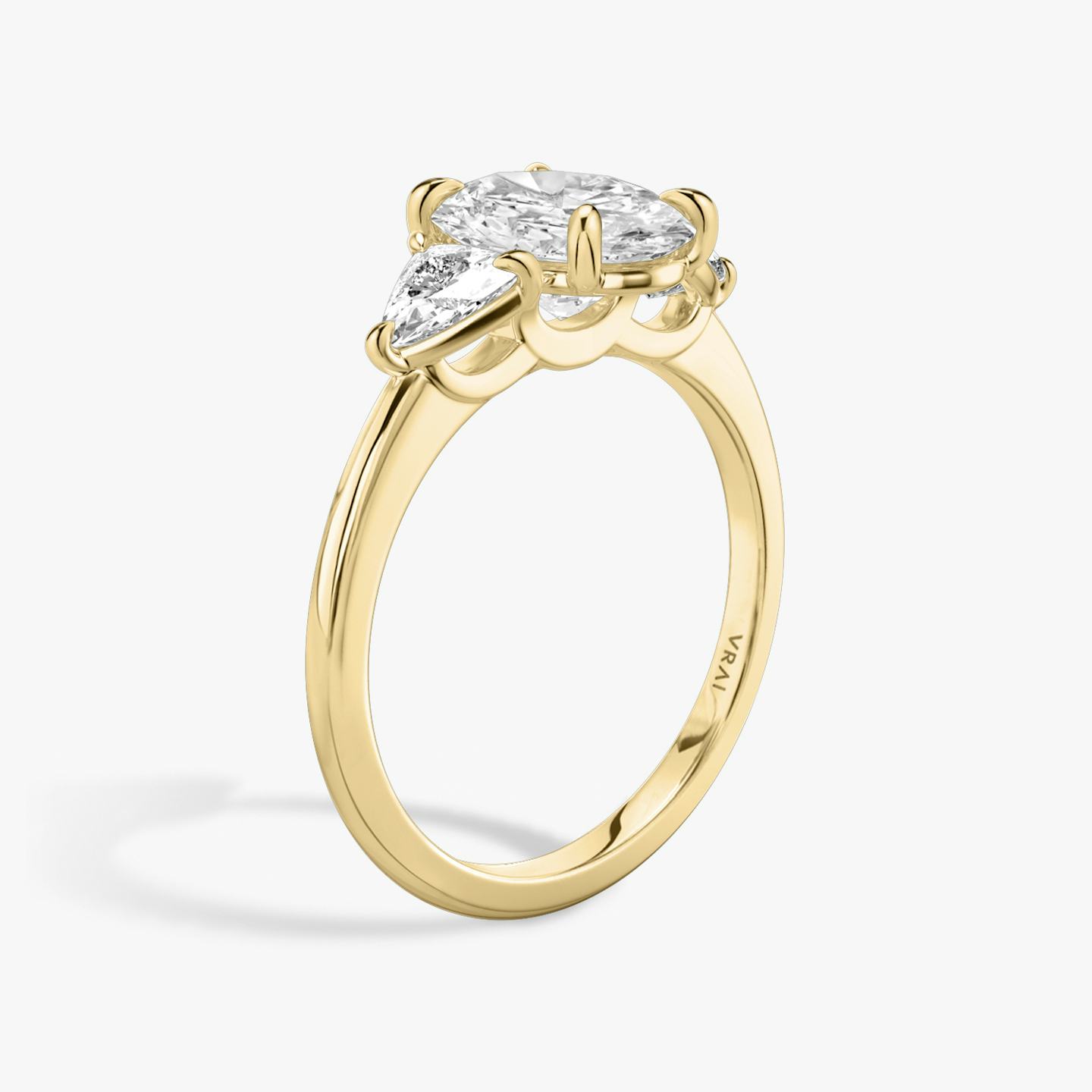 The Three Stone | Oval | 18k | 18k Yellow Gold | Band: Plain | Side stone carat: 1/4 | Side stone shape: Trillion | Diamond orientation: vertical | Carat weight: See full inventory
