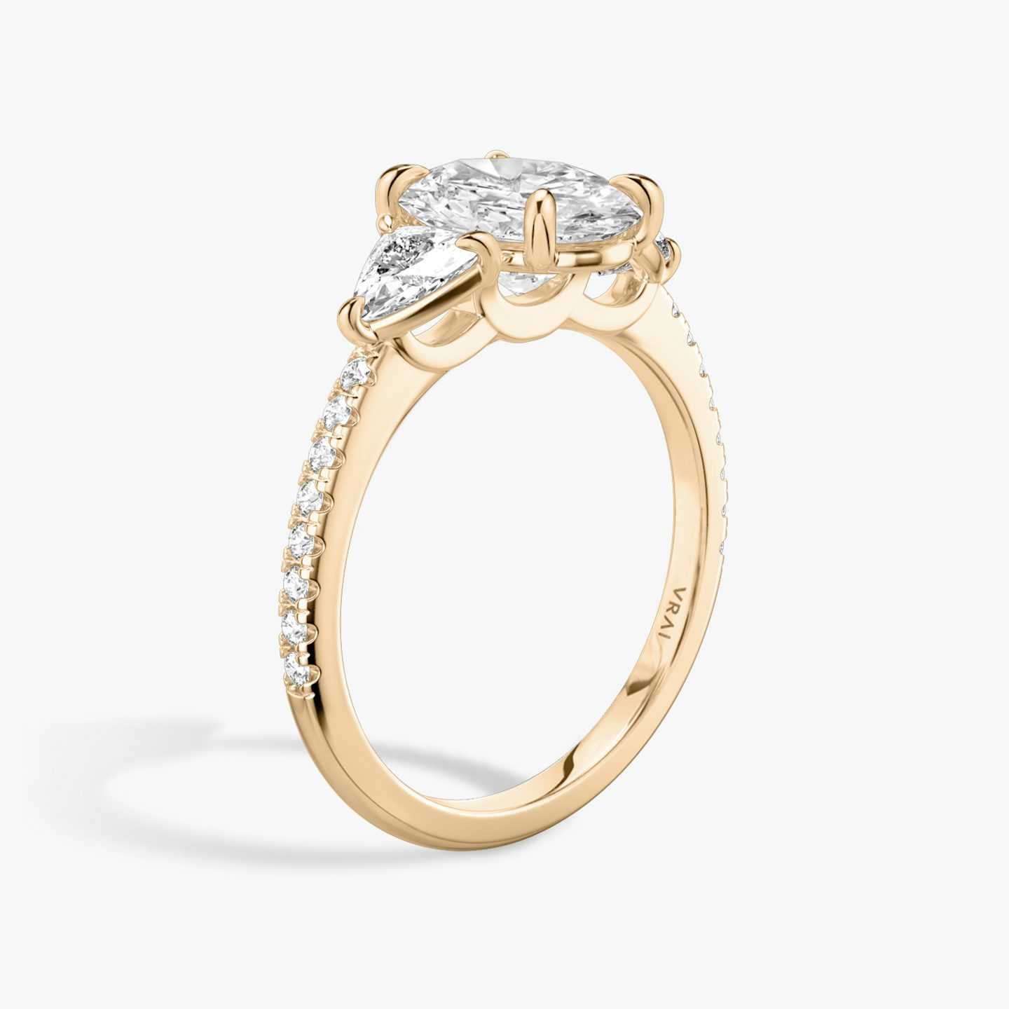 The Three Stone | Oval | 14k | 14k Rose Gold | Band: Pavé | Side stone carat: 1/4 | Side stone shape: Trillion | Diamond orientation: vertical | Carat weight: See full inventory