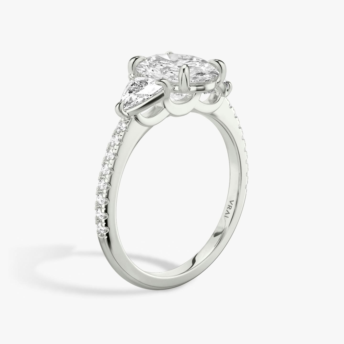 The Three Stone | Oval | Platinum | Band: Pavé | Side stone carat: 1/4 | Side stone shape: Trillion | Diamond orientation: vertical | Carat weight: See full inventory