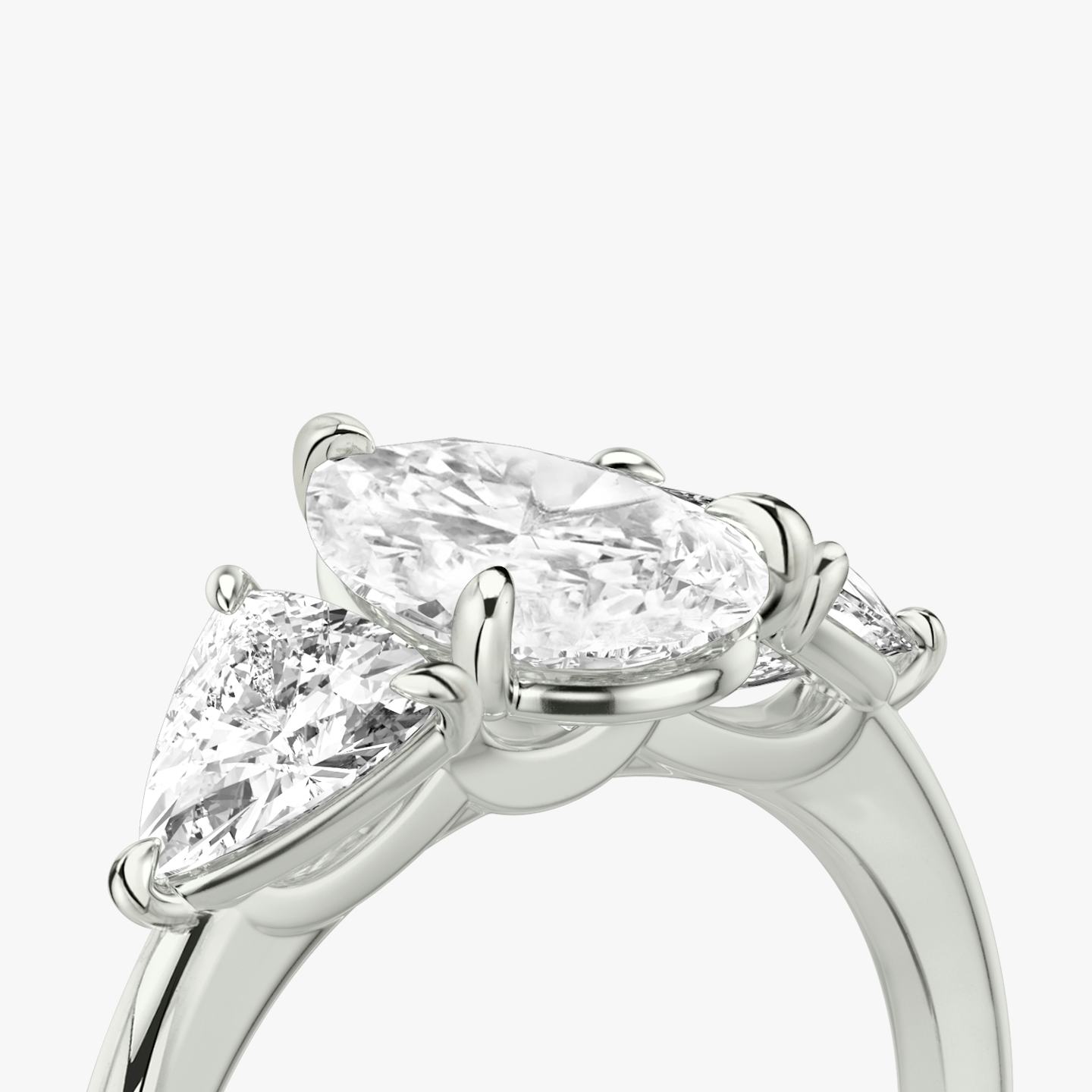The Three Stone | Pear | 18k | 18k White Gold | Band: Plain | Side stone carat: 1/2 | Side stone shape: Trillion | Diamond orientation: vertical | Carat weight: See full inventory