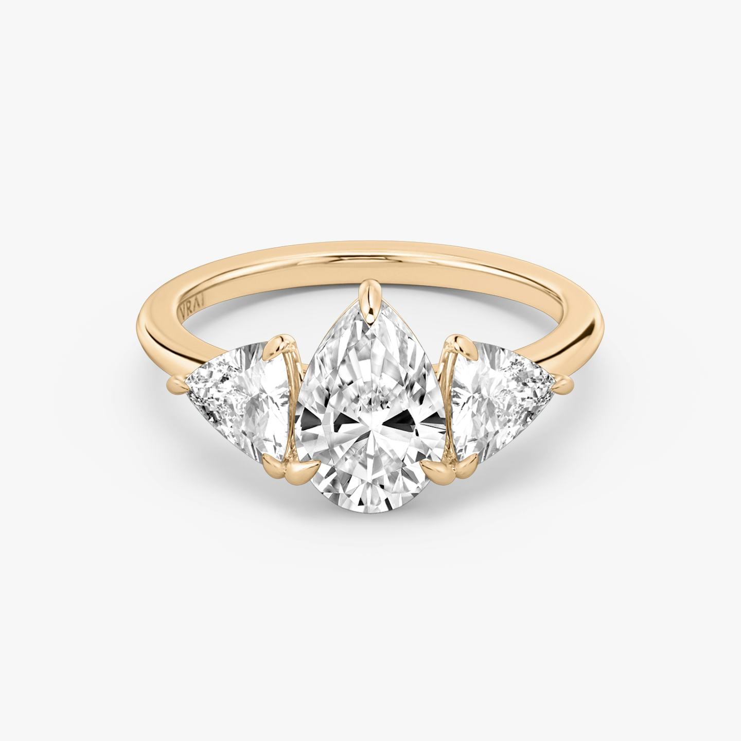 The Three Stone | Pear | 14k | 14k Rose Gold | Band: Plain | Side stone carat: 1/2 | Side stone shape: Trillion | Diamond orientation: vertical | Carat weight: See full inventory