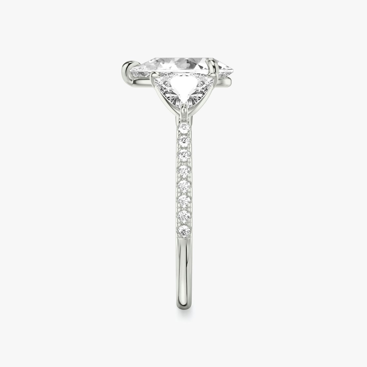 The Three Stone | Pear | 18k | 18k White Gold | Band: Pavé | Side stone carat: 1/2 | Side stone shape: Trillion | Diamond orientation: vertical | Carat weight: See full inventory