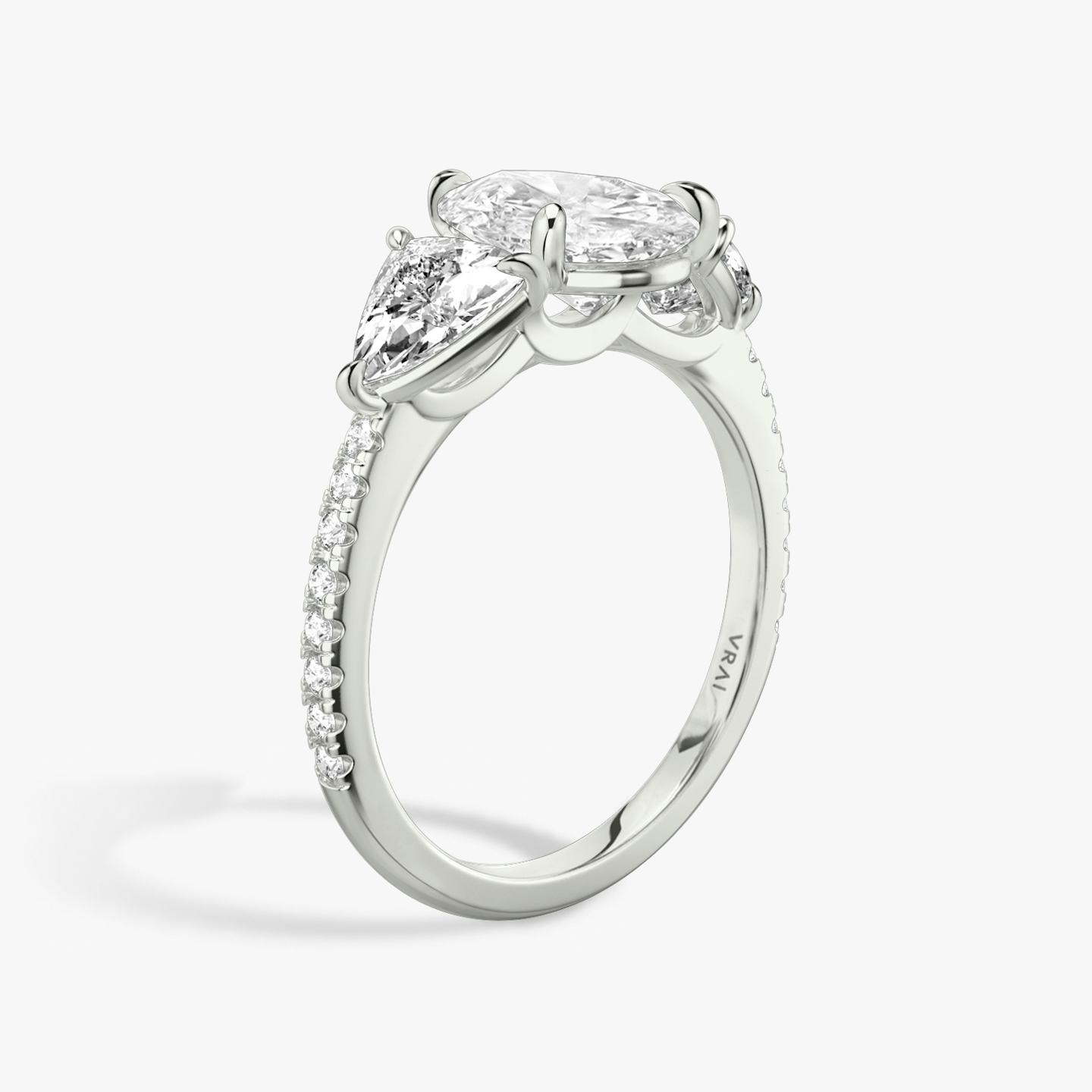 The Three Stone | Pear | Platinum | Band: Pavé | Side stone carat: 1/2 | Side stone shape: Trillion | Diamond orientation: vertical | Carat weight: See full inventory