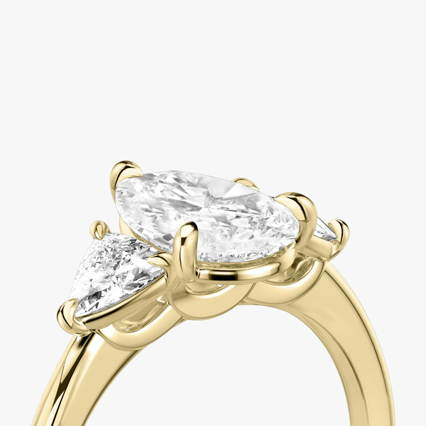 The Three Stone | Pear | 18k | 18k Yellow Gold | Band: Plain | Side stone carat: 1/4 | Side stone shape: Trillion | Diamond orientation: vertical | Carat weight: See full inventory