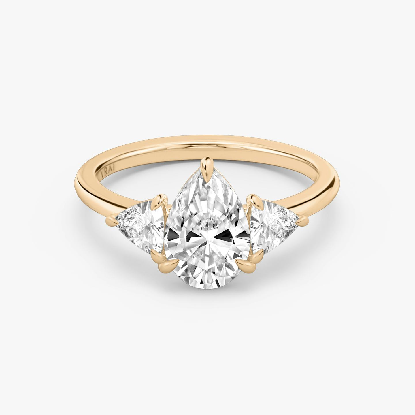 The Three Stone | Pear | 14k | 14k Rose Gold | Band: Plain | Side stone carat: 1/4 | Side stone shape: Trillion | Diamond orientation: vertical | Carat weight: See full inventory