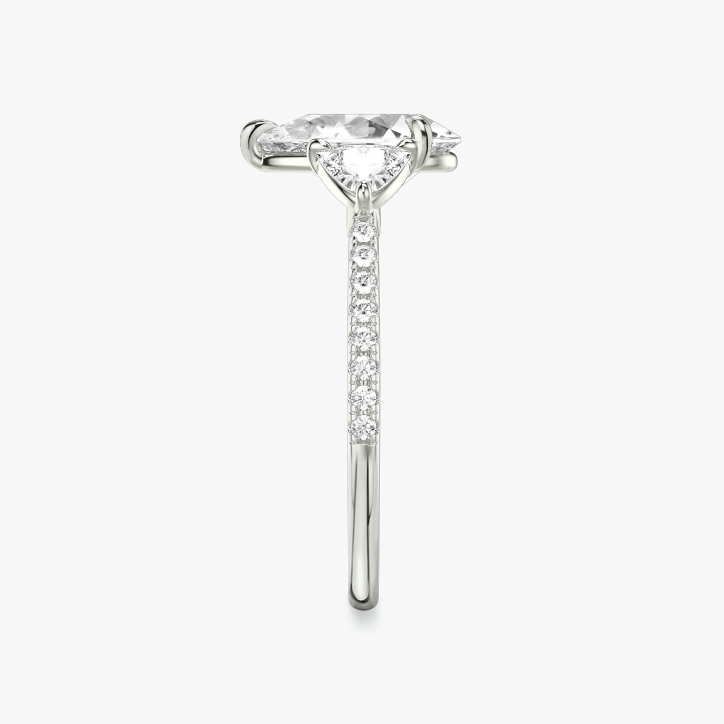 The Three Stone | Pear | 18k | 18k White Gold | Band: Pavé | Side stone carat: 1/4 | Side stone shape: Trillion | Diamond orientation: vertical | Carat weight: See full inventory
