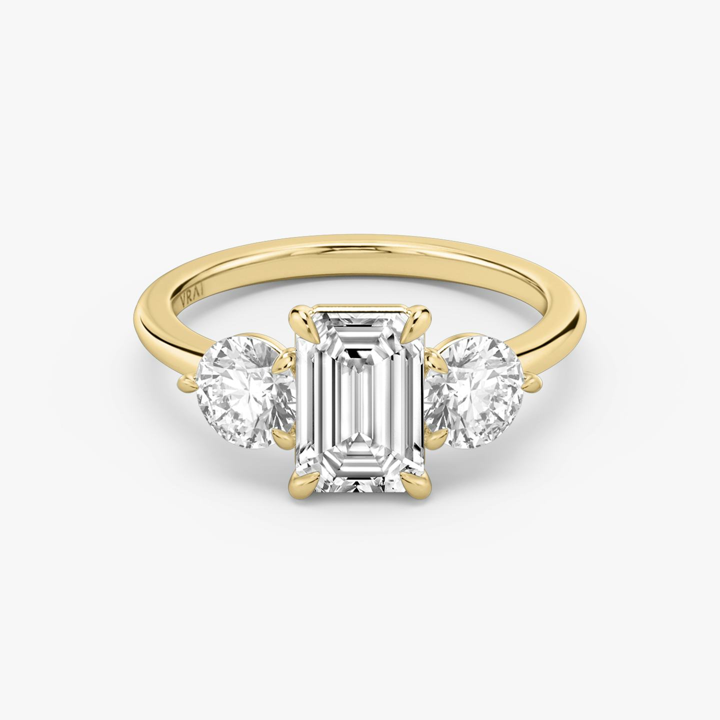The Three Stone | Emerald | 18k | 18k Yellow Gold | Band: Plain | Side stone carat: 1/2 | Side stone shape: Round Brilliant | Diamond orientation: vertical | Carat weight: See full inventory