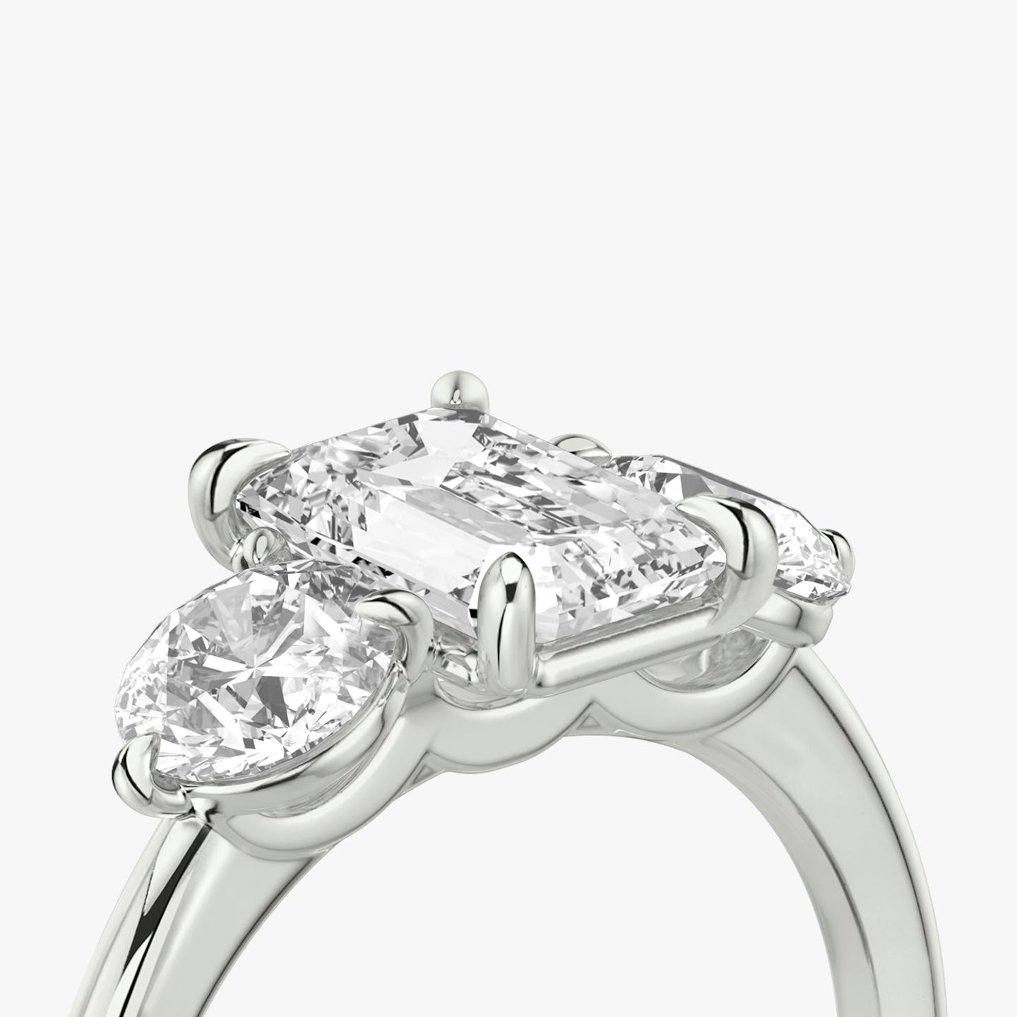 The Three Stone | Emerald | 18k | 18k White Gold | Band: Plain | Side stone carat: 1/2 | Side stone shape: Round Brilliant | Diamond orientation: vertical | Carat weight: See full inventory
