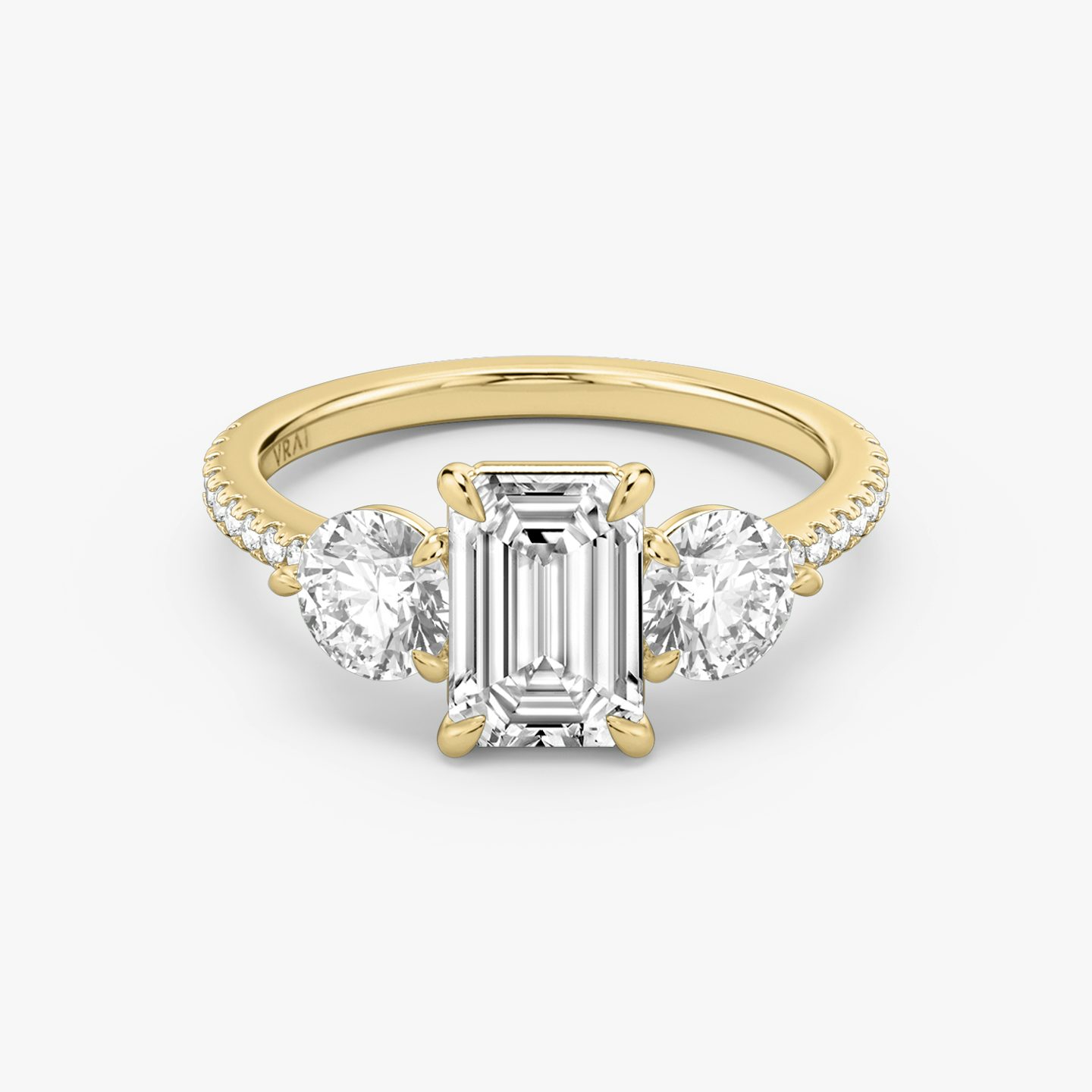 The Three Stone | Emerald | 18k | 18k Yellow Gold | Band: Pavé | Side stone carat: 1/2 | Side stone shape: Round Brilliant | Diamond orientation: vertical | Carat weight: See full inventory