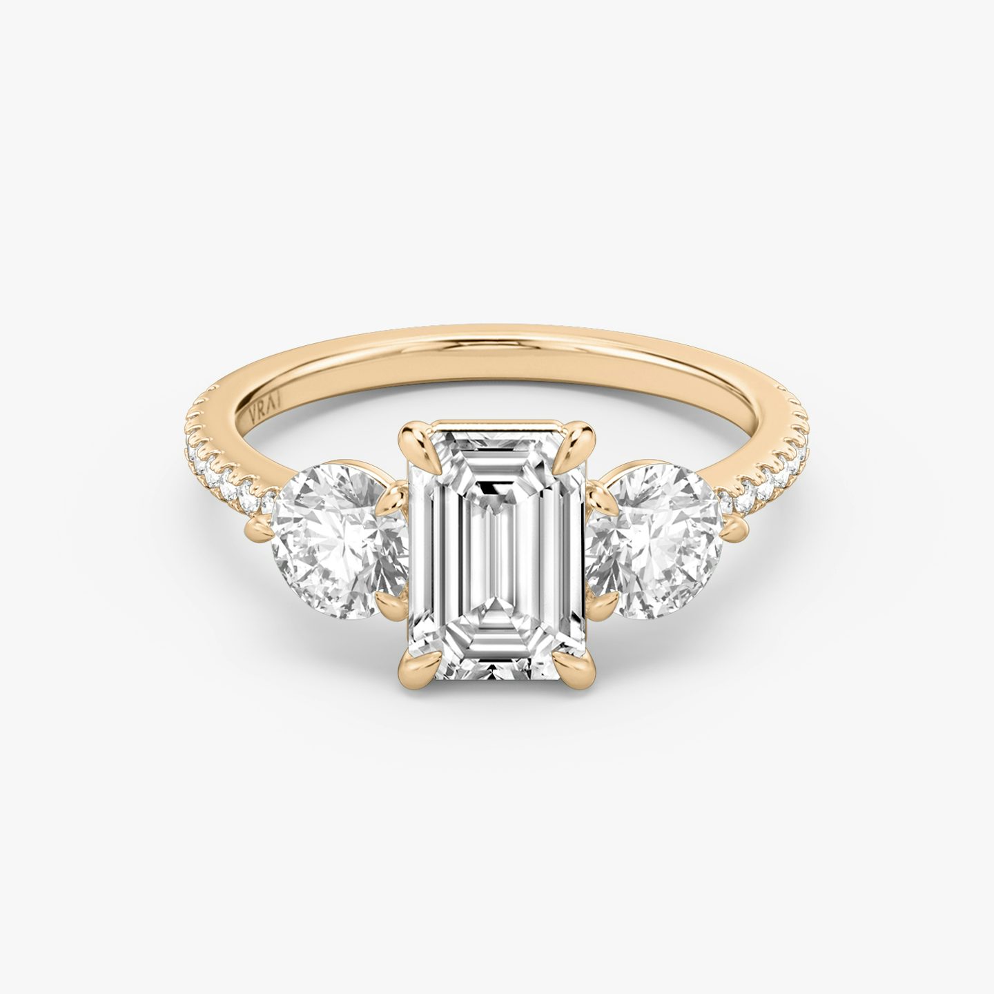 The Three Stone | Emerald | 14k | 14k Rose Gold | Band: Pavé | Side stone carat: 1/2 | Side stone shape: Round Brilliant | Diamond orientation: vertical | Carat weight: See full inventory