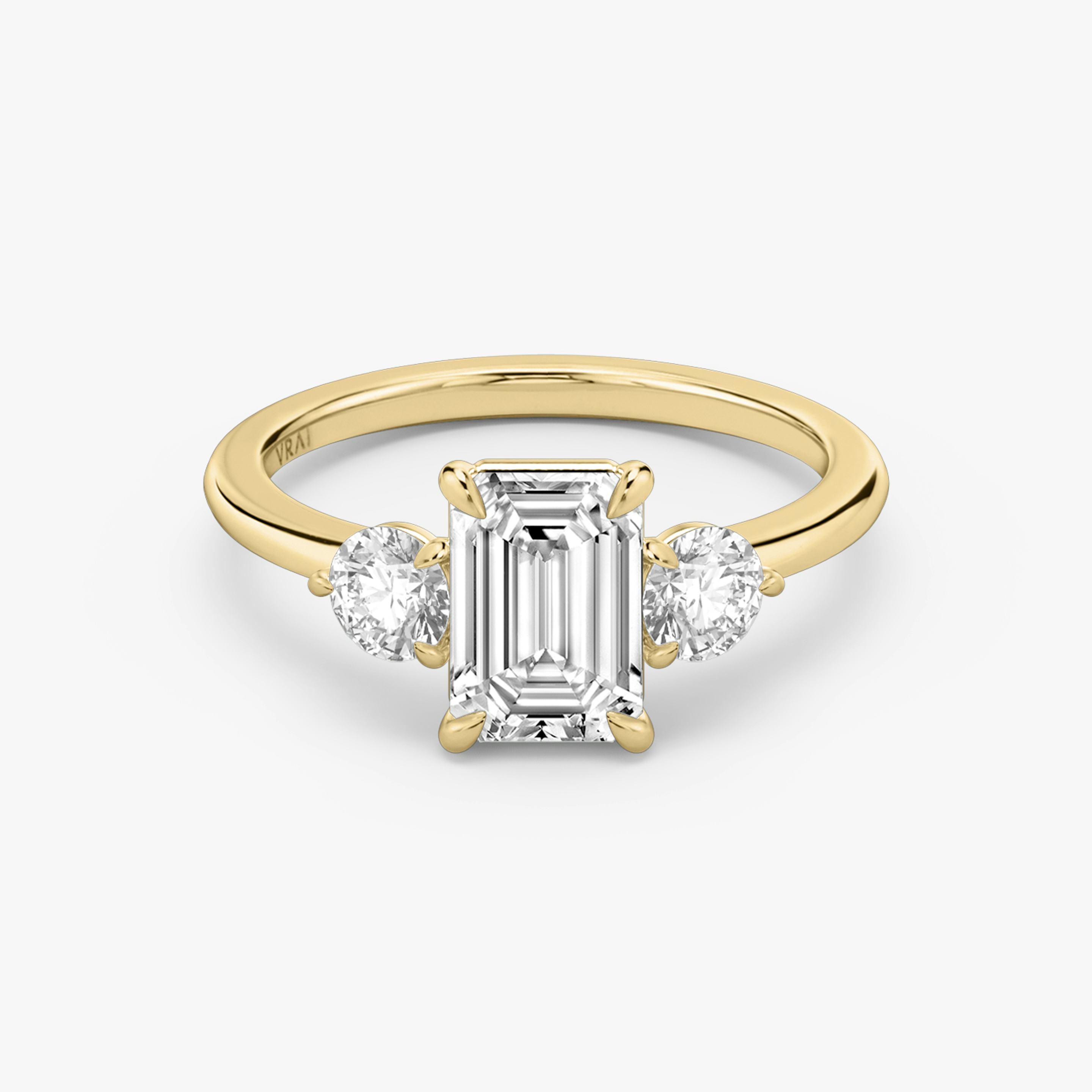 The Three Stone | Emerald | 18k | 18k Yellow Gold | Band: Plain | Side stone carat: 1/4 | Side stone shape: Round Brilliant | Diamond orientation: vertical | Carat weight: See full inventory