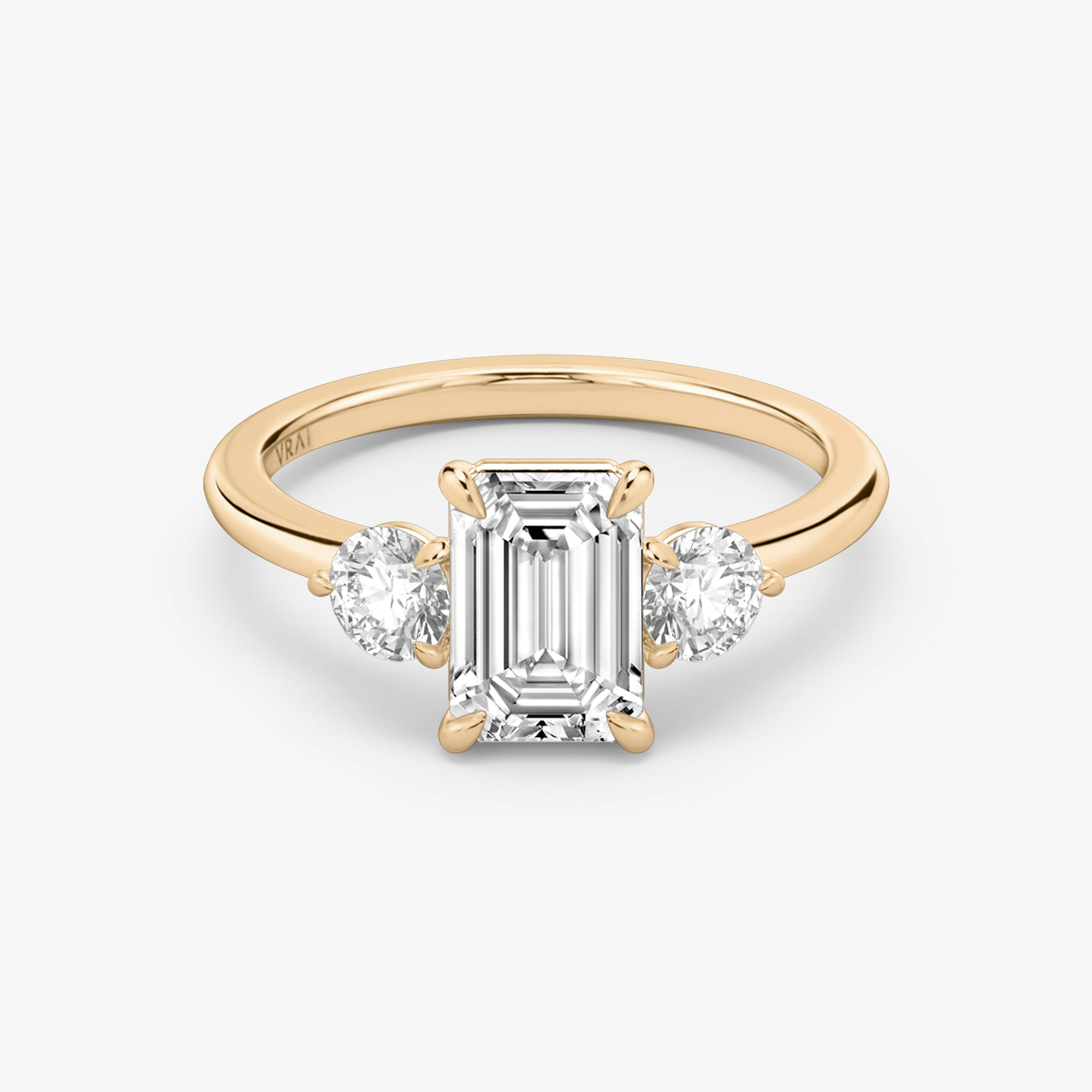 The Three Stone | Emerald | 14k | 14k Rose Gold | Band: Plain | Side stone carat: 1/4 | Side stone shape: Round Brilliant | Diamond orientation: vertical | Carat weight: See full inventory