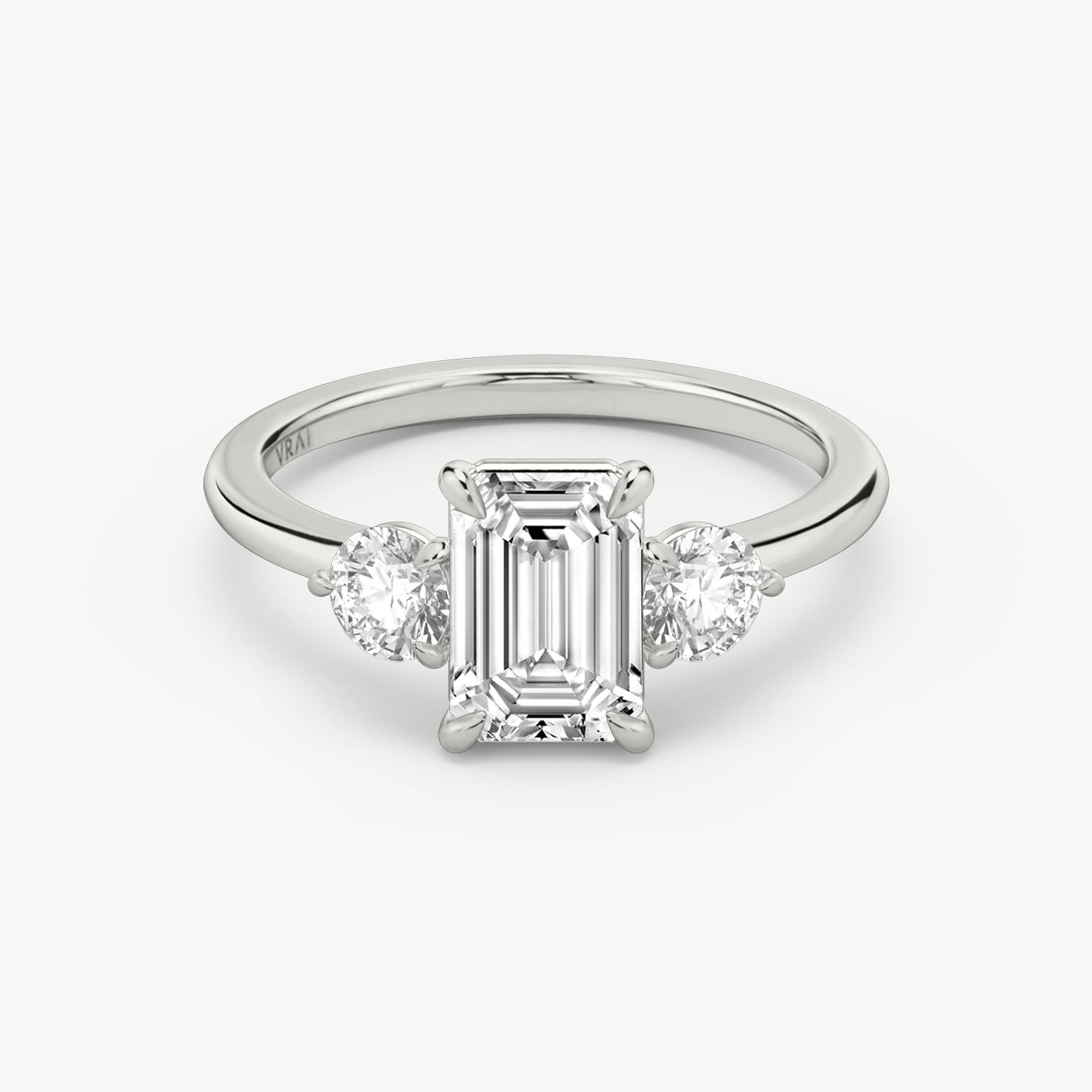 Emerald cut diamond with round side stones Clearance