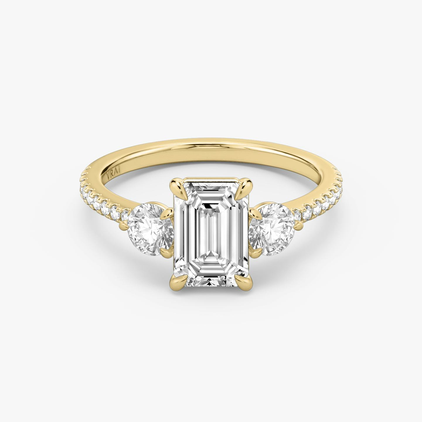 The Three Stone | Emerald | 18k | 18k Yellow Gold | Band: Pavé | Side stone carat: 1/4 | Side stone shape: Round Brilliant | Diamond orientation: vertical | Carat weight: See full inventory