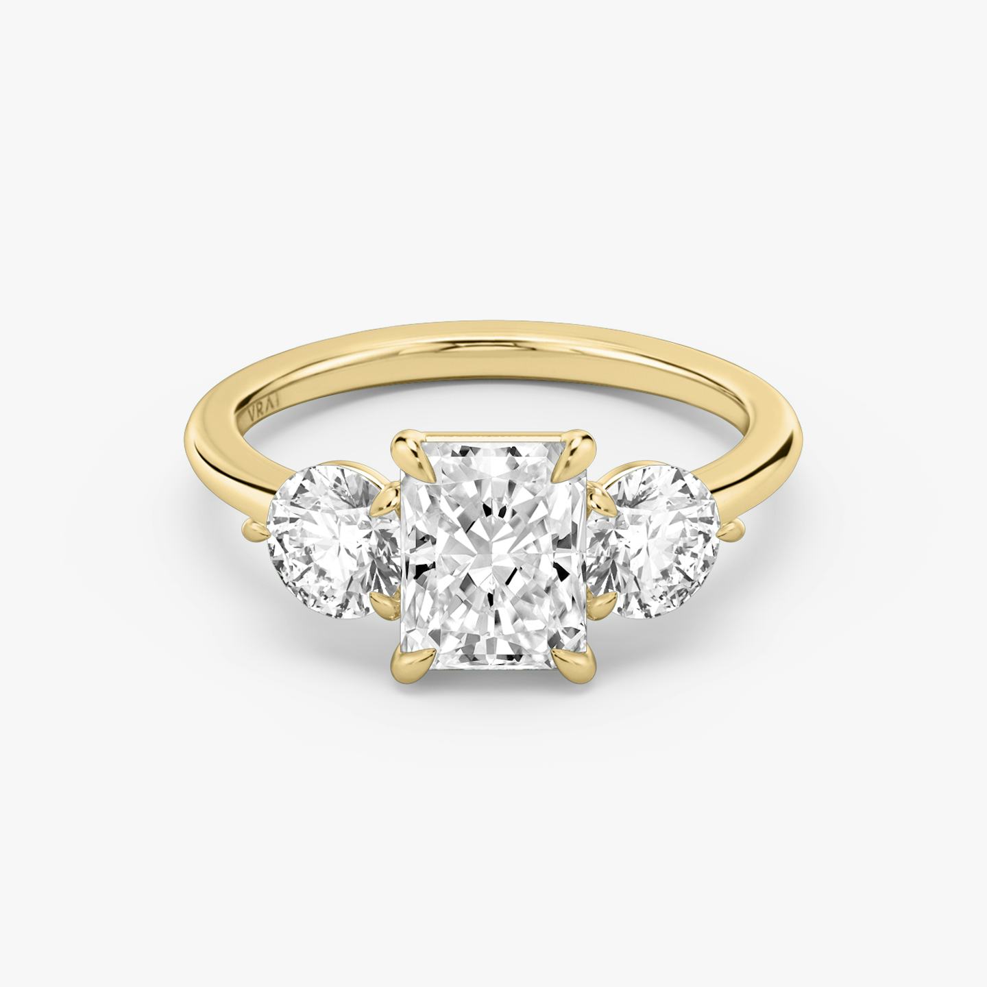The Three Stone | Radiant | 18k | 18k Yellow Gold | Band: Plain | Side stone carat: 1/2 | Side stone shape: Round Brilliant | Diamond orientation: vertical | Carat weight: See full inventory