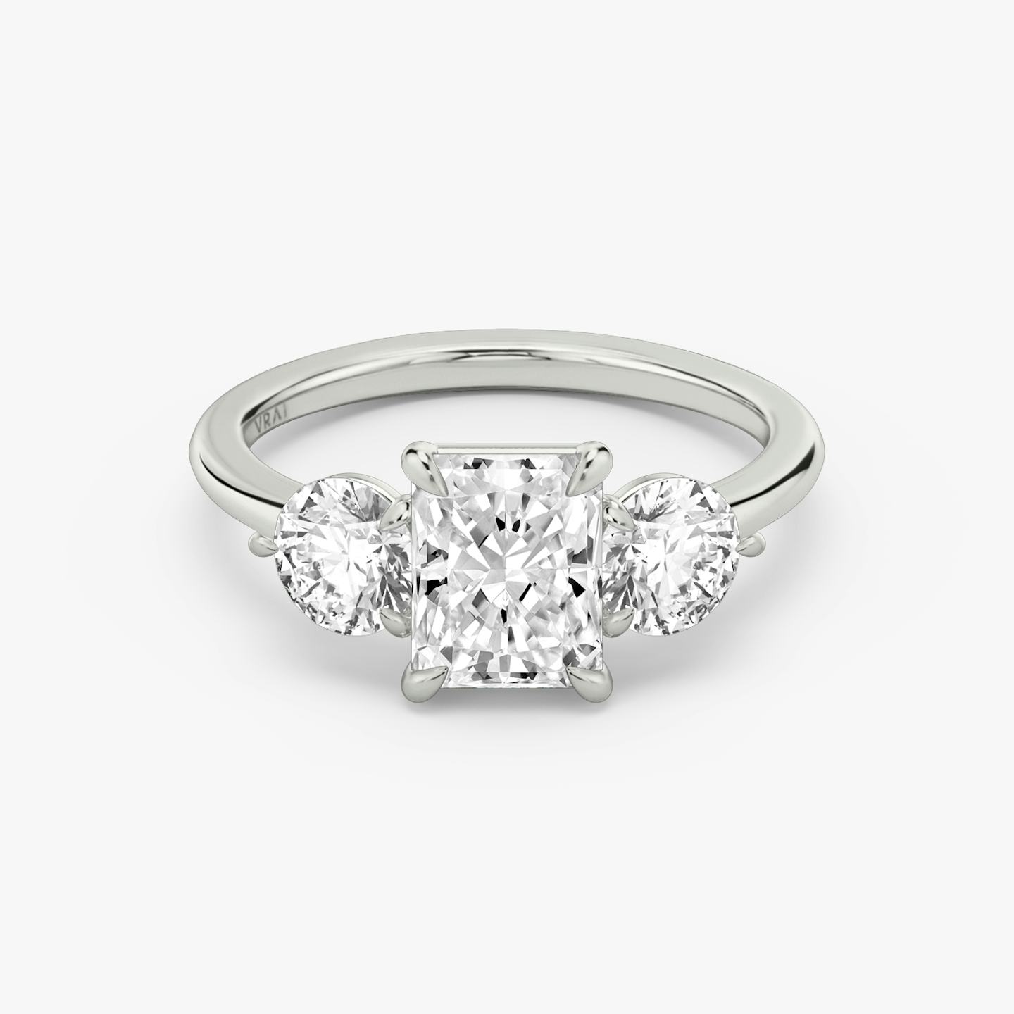 The Three Stone | Radiant | 18k | 18k White Gold | Band: Plain | Side stone carat: 1/2 | Side stone shape: Round Brilliant | Diamond orientation: vertical | Carat weight: See full inventory