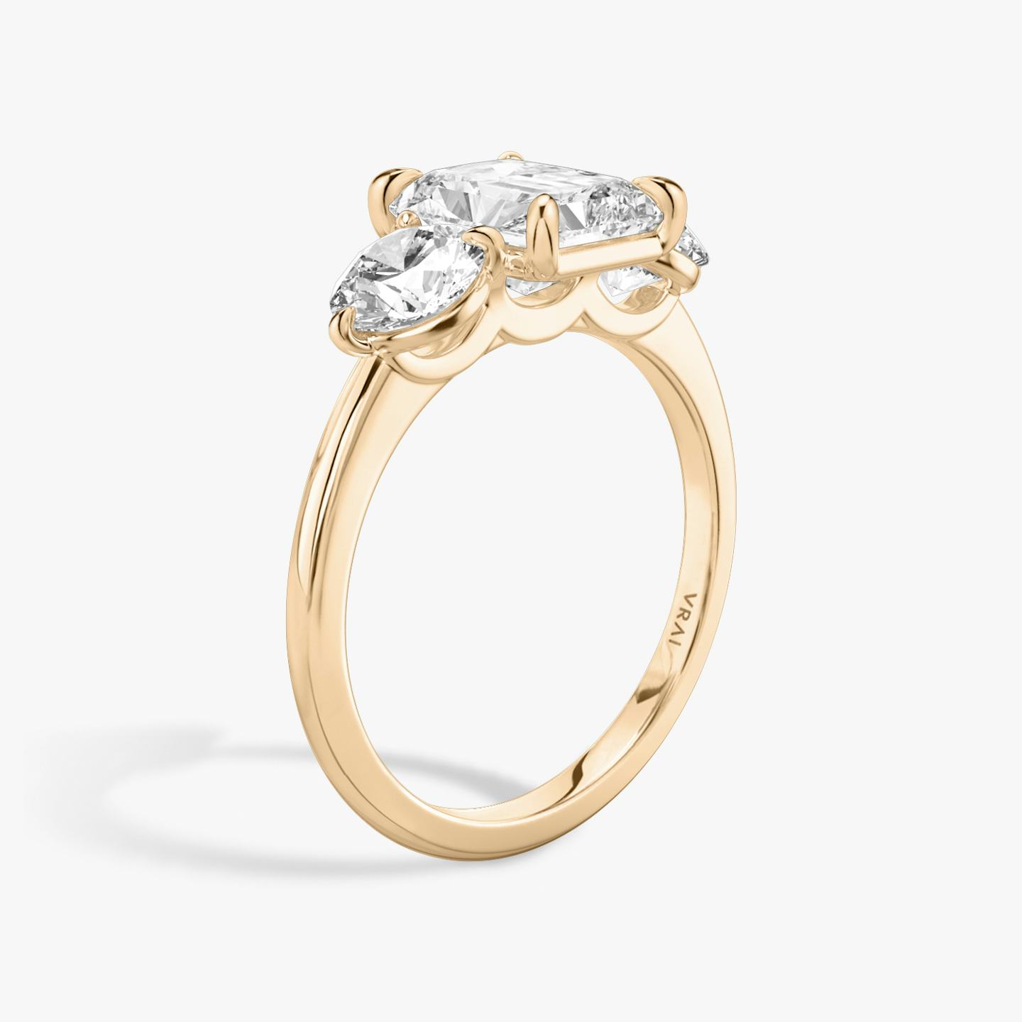 The Three Stone | Radiant | 14k | 14k Rose Gold | Band: Plain | Side stone carat: 1/2 | Side stone shape: Round Brilliant | Diamond orientation: vertical | Carat weight: See full inventory