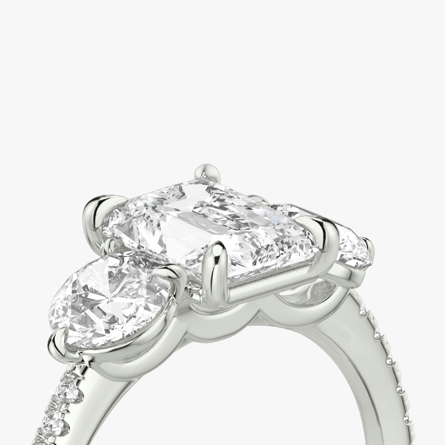 The Three Stone | Radiant | 18k | 18k White Gold | Band: Pavé | Side stone carat: 1/2 | Side stone shape: Round Brilliant | Diamond orientation: vertical | Carat weight: See full inventory