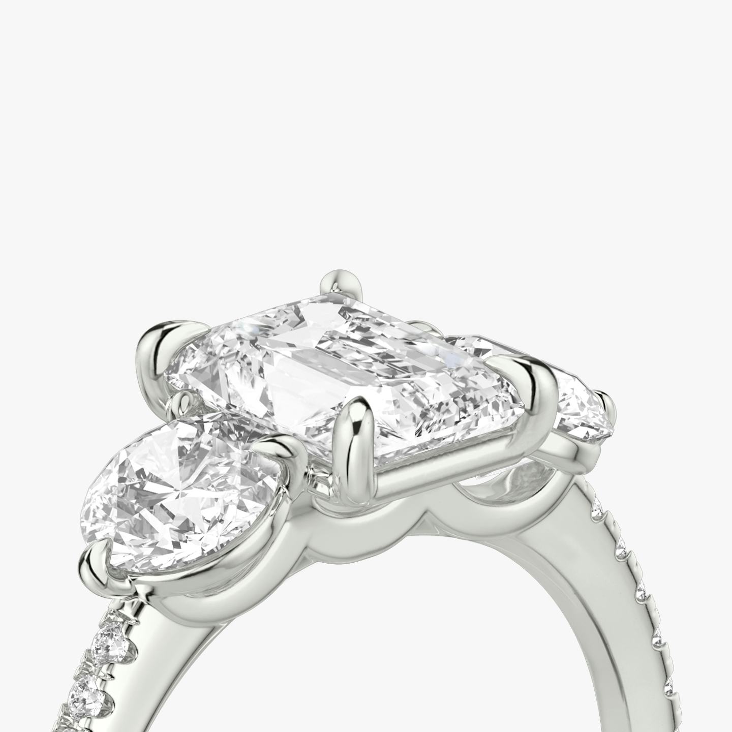 The Three Stone | Radiant | Platinum | Band: Pavé | Side stone carat: 1/2 | Side stone shape: Round Brilliant | Diamond orientation: vertical | Carat weight: See full inventory