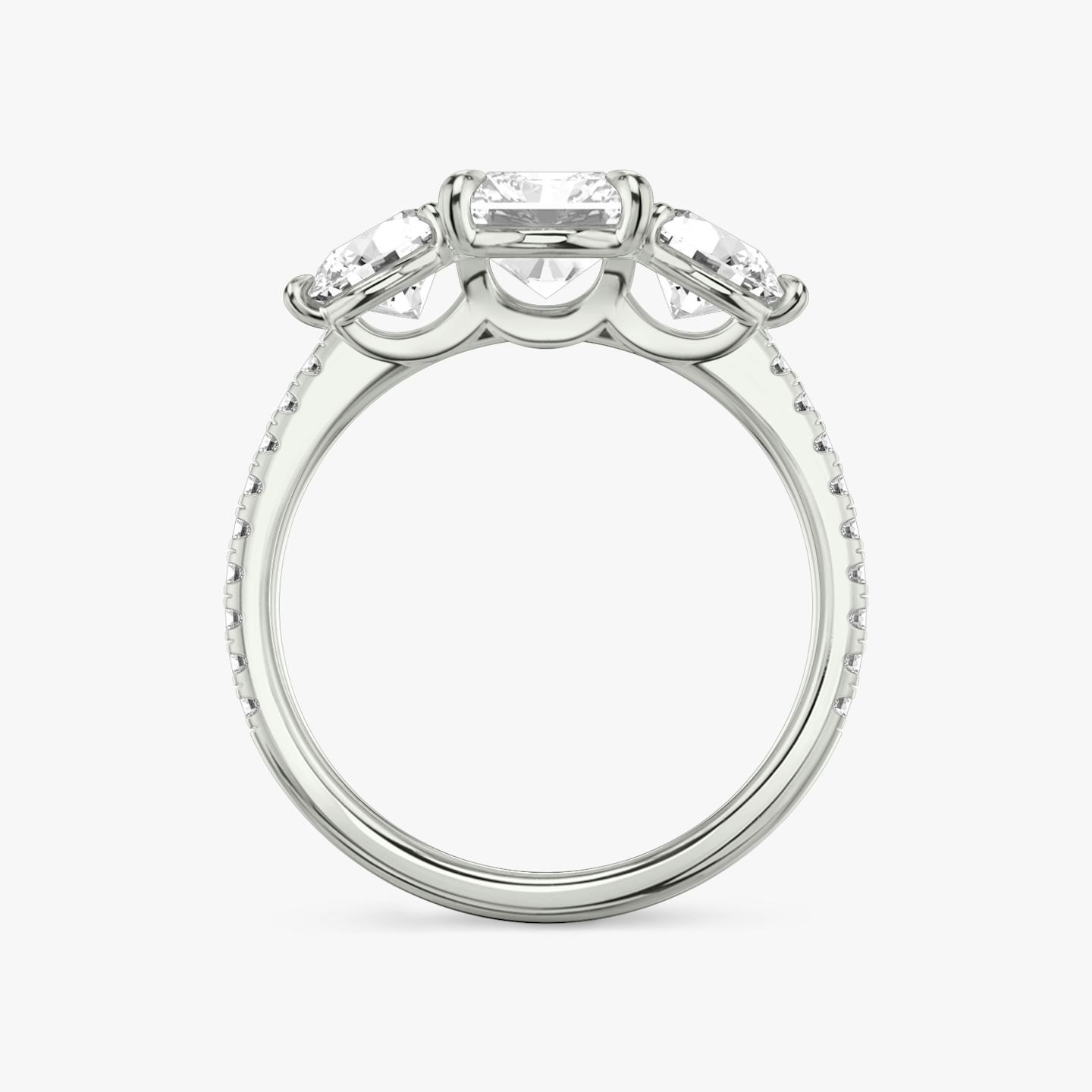 The Three Stone | Radiant | Platinum | Band: Pavé | Side stone carat: 1/2 | Side stone shape: Round Brilliant | Diamond orientation: vertical | Carat weight: See full inventory