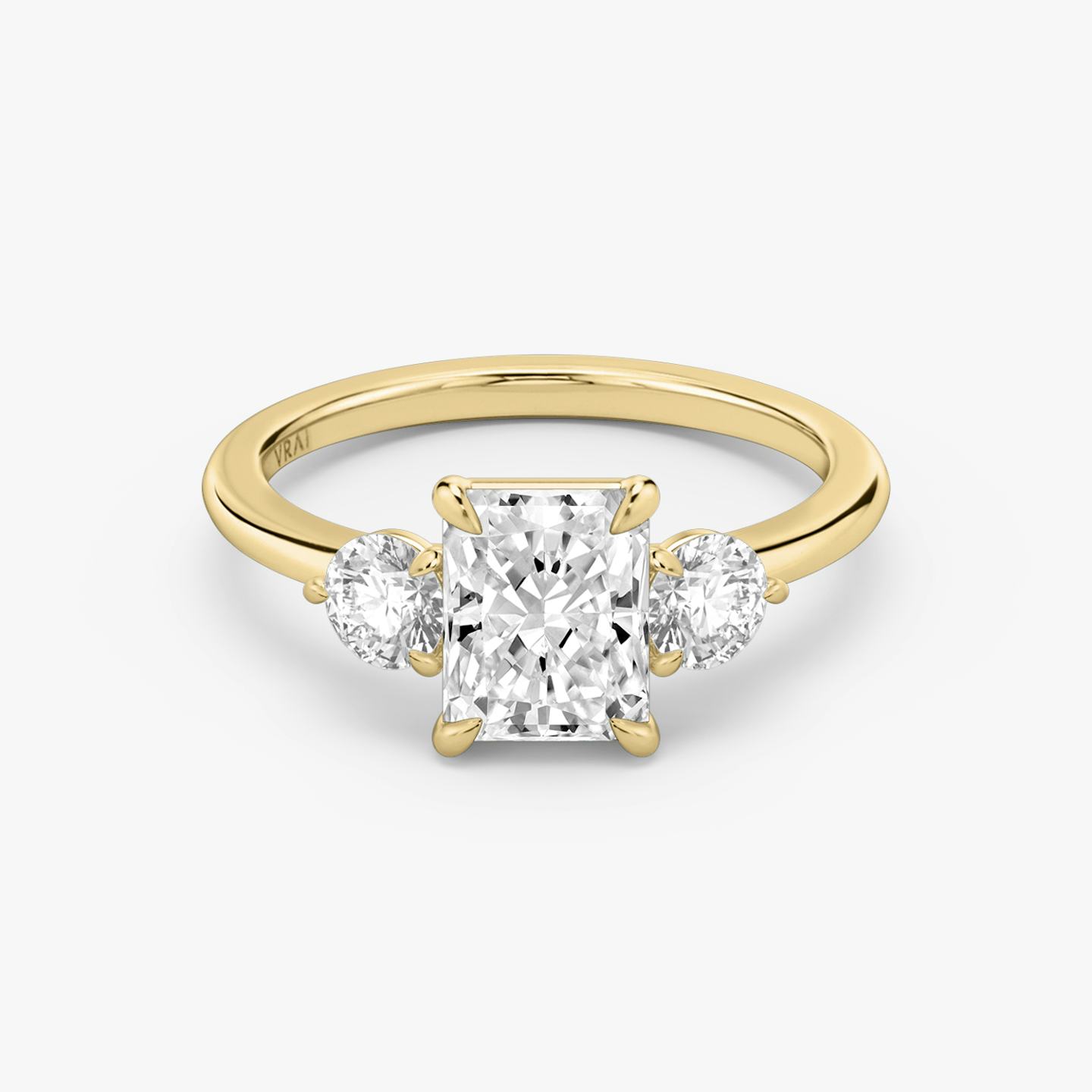 The Three Stone | Radiant | 18k | 18k Yellow Gold | Band: Plain | Side stone carat: 1/4 | Side stone shape: Round Brilliant | Diamond orientation: vertical | Carat weight: See full inventory
