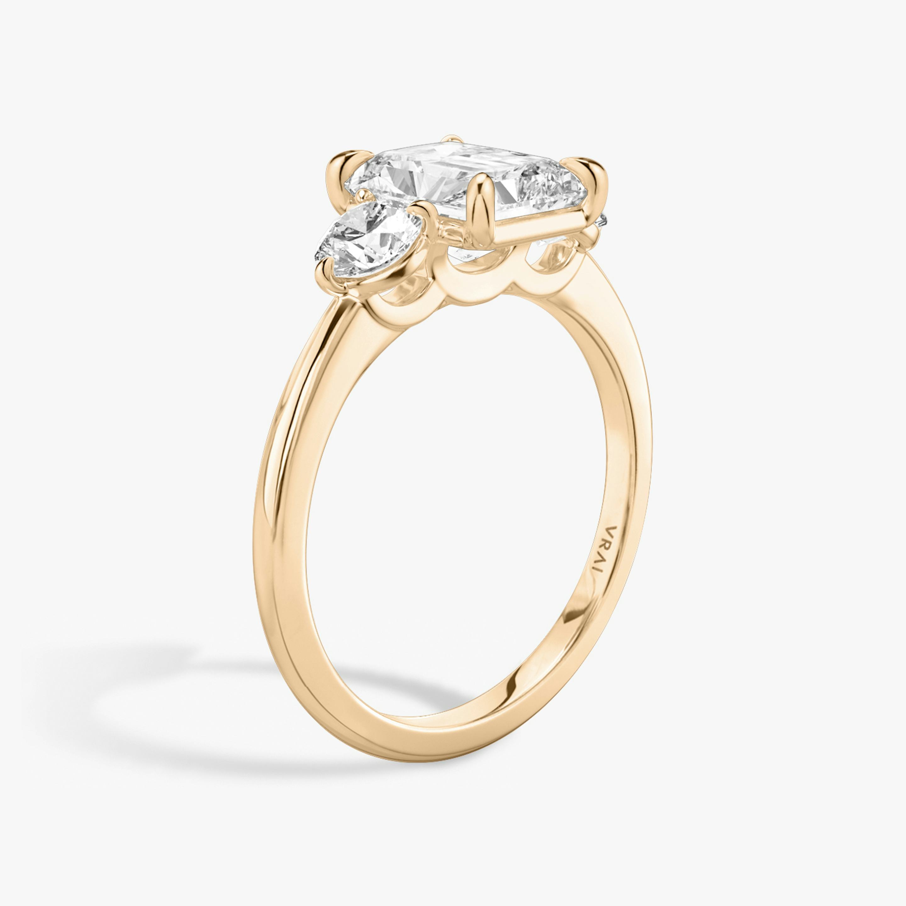 The Three Stone | Radiant | 14k | 14k Rose Gold | Band: Plain | Side stone carat: 1/4 | Side stone shape: Round Brilliant | Diamond orientation: vertical | Carat weight: See full inventory