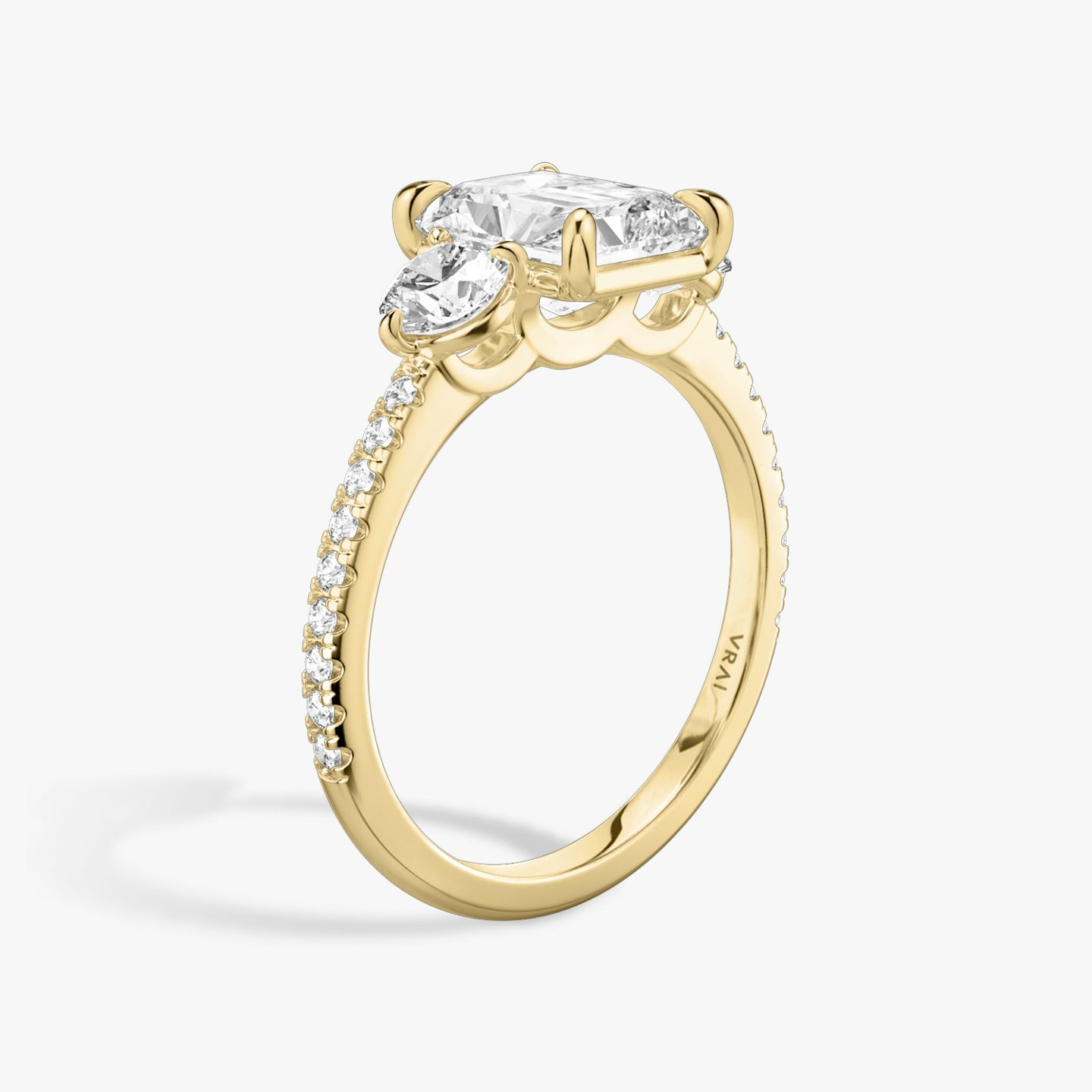 The Three Stone | Radiant | 18k | 18k Yellow Gold | Band: Pavé | Side stone carat: 1/4 | Side stone shape: Round Brilliant | Diamond orientation: vertical | Carat weight: See full inventory