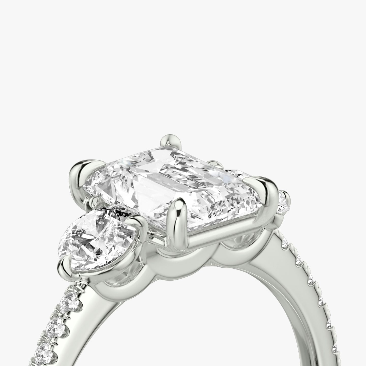 The Three Stone | Radiant | 18k | 18k White Gold | Band: Pavé | Side stone carat: 1/4 | Side stone shape: Round Brilliant | Diamond orientation: vertical | Carat weight: See full inventory