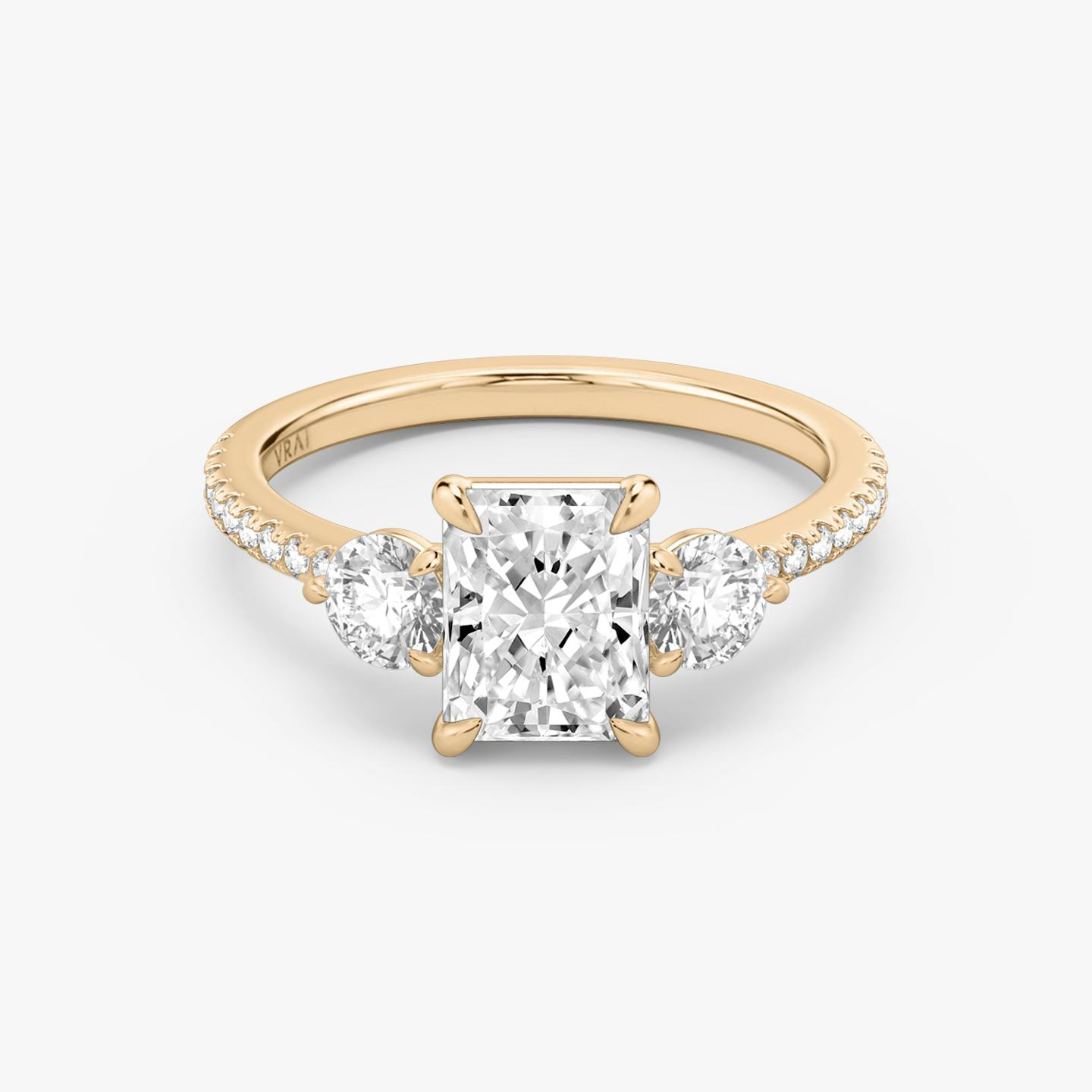The Three Stone | Radiant | 14k | 14k Rose Gold | Band: Pavé | Side stone carat: 1/4 | Side stone shape: Round Brilliant | Diamond orientation: vertical | Carat weight: See full inventory