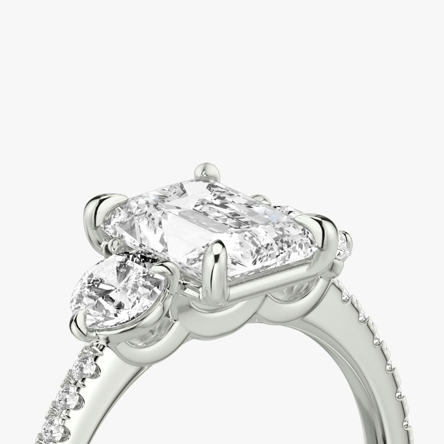 The Three Stone | Radiant | Platinum | Band: Pavé | Side stone carat: 1/4 | Side stone shape: Round Brilliant | Diamond orientation: vertical | Carat weight: See full inventory