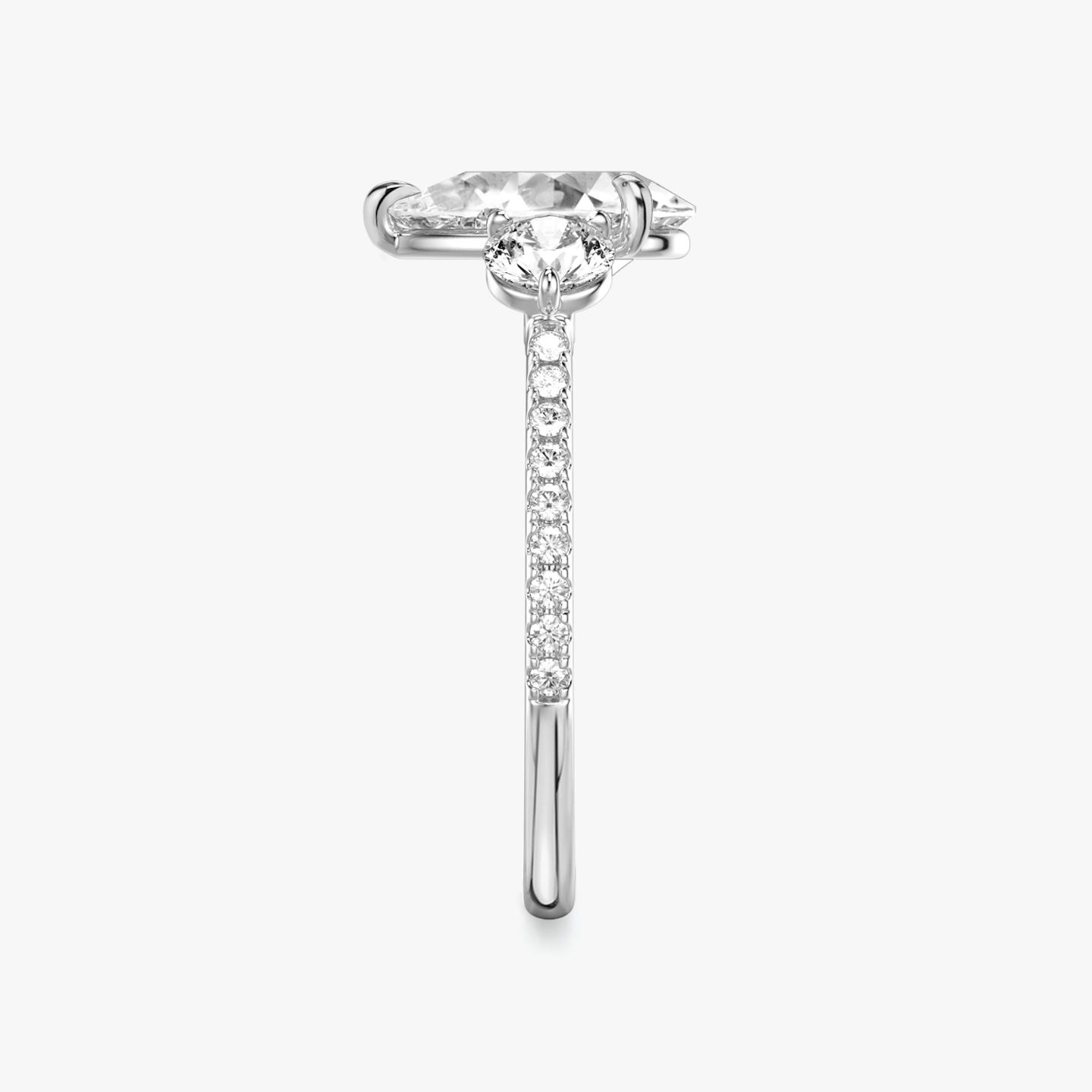 The Three Stone | Pear | 18k | 18k White Gold | Band: Pavé | Side stone carat: 1/4 | Side stone shape: Round Brilliant | Diamond orientation: vertical | Carat weight: See full inventory