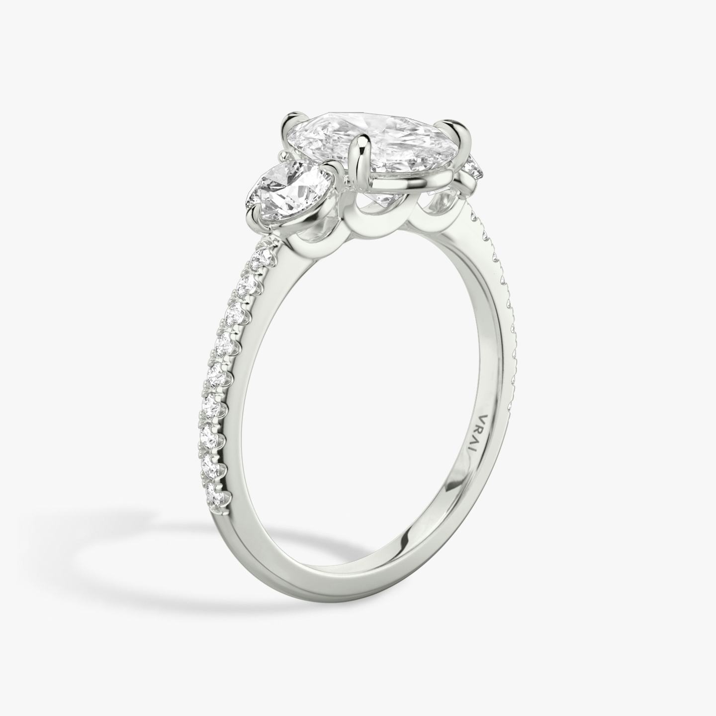 The Three Stone | Pear | 18k | 18k White Gold | Band: Pavé | Side stone carat: 1/4 | Side stone shape: Round Brilliant | Diamond orientation: vertical | Carat weight: See full inventory