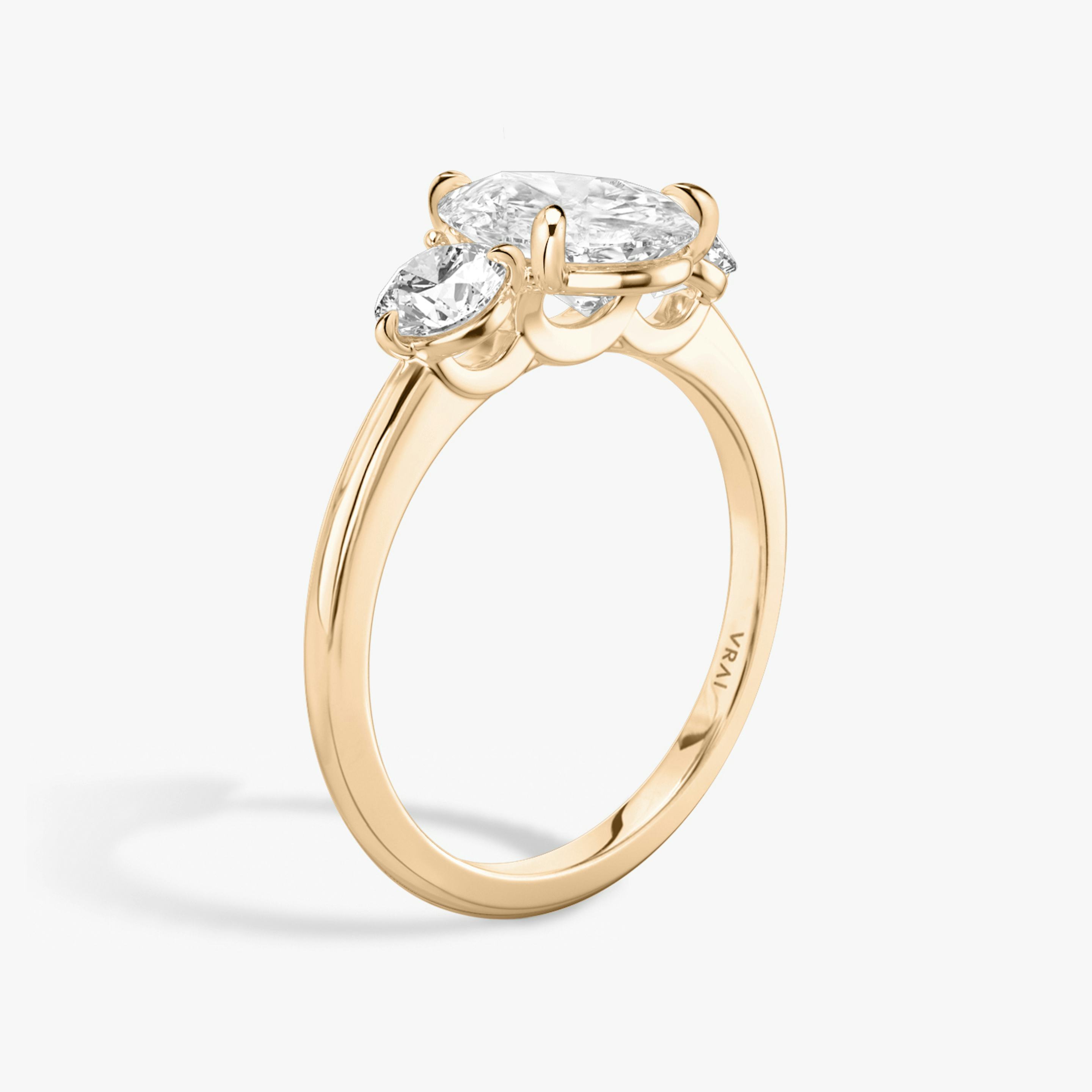 The Three Stone | Pear | 14k | 14k Rose Gold | Band: Plain | Side stone carat: 1/4 | Side stone shape: Round Brilliant | Diamond orientation: vertical | Carat weight: See full inventory