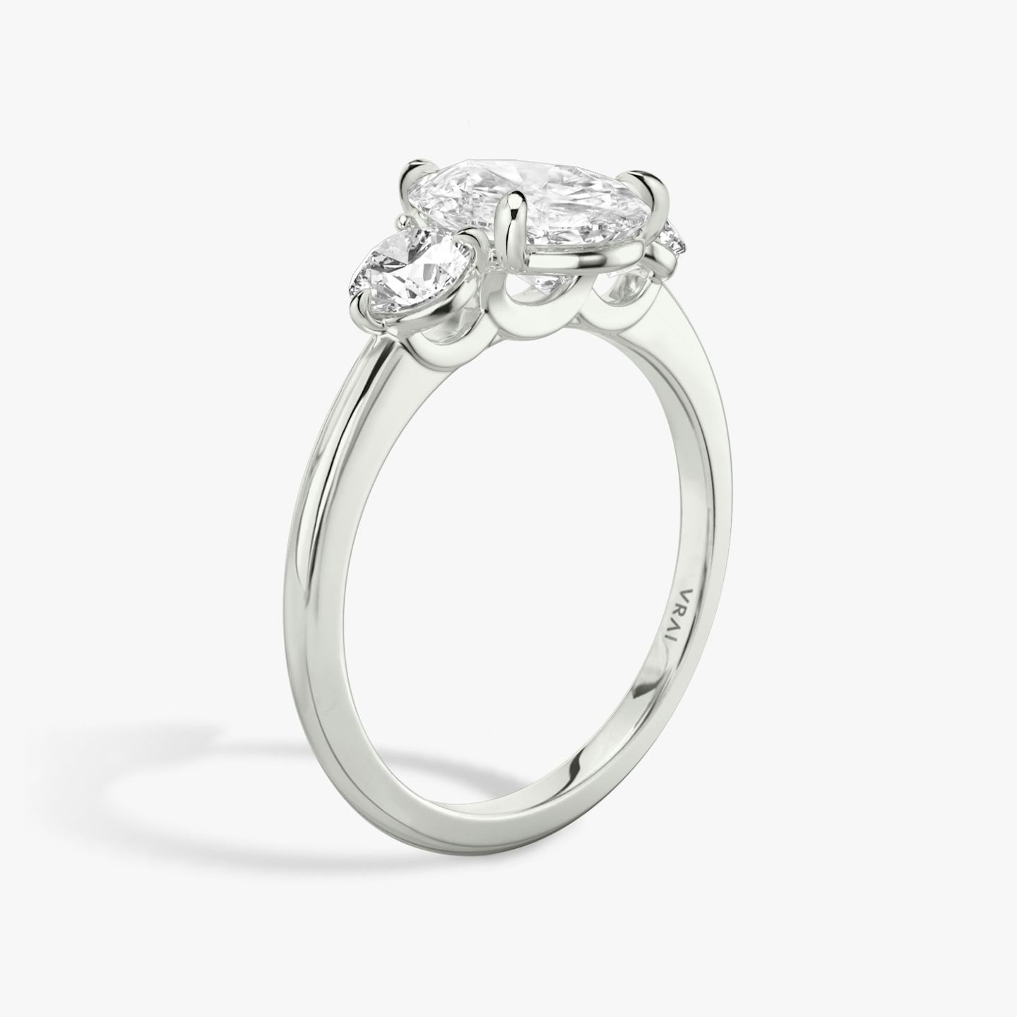 The Three Stone | Pear | Platinum | Band: Plain | Side stone carat: 1/4 | Side stone shape: Round Brilliant | Diamond orientation: vertical | Carat weight: See full inventory