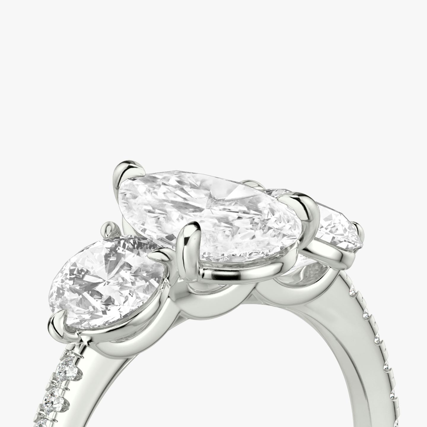 The Three Stone | Pear | Platinum | Band: Pavé | Side stone carat: 1/2 | Side stone shape: Round Brilliant | Diamond orientation: vertical | Carat weight: See full inventory