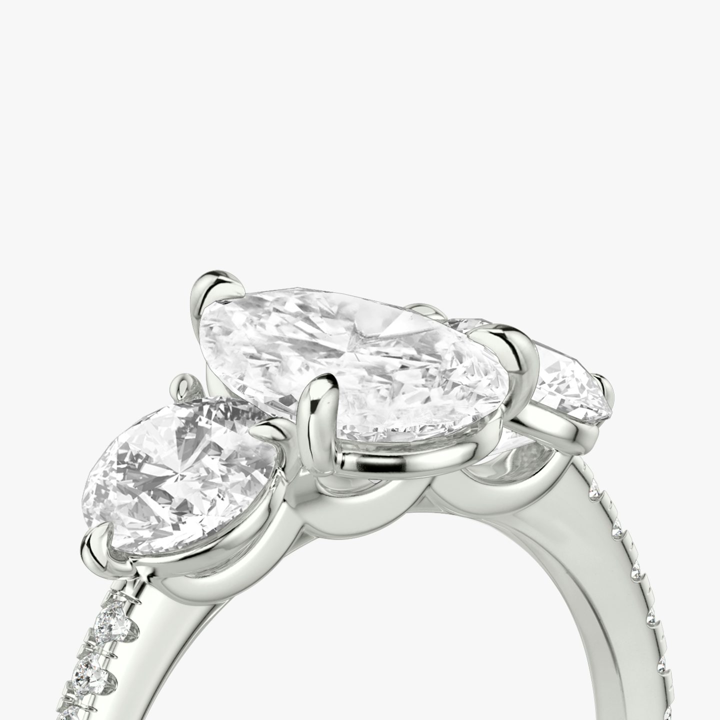 The Three Stone | Pear | 18k | 18k White Gold | Band: Pavé | Side stone carat: 1/2 | Side stone shape: Round Brilliant | Diamond orientation: vertical | Carat weight: See full inventory