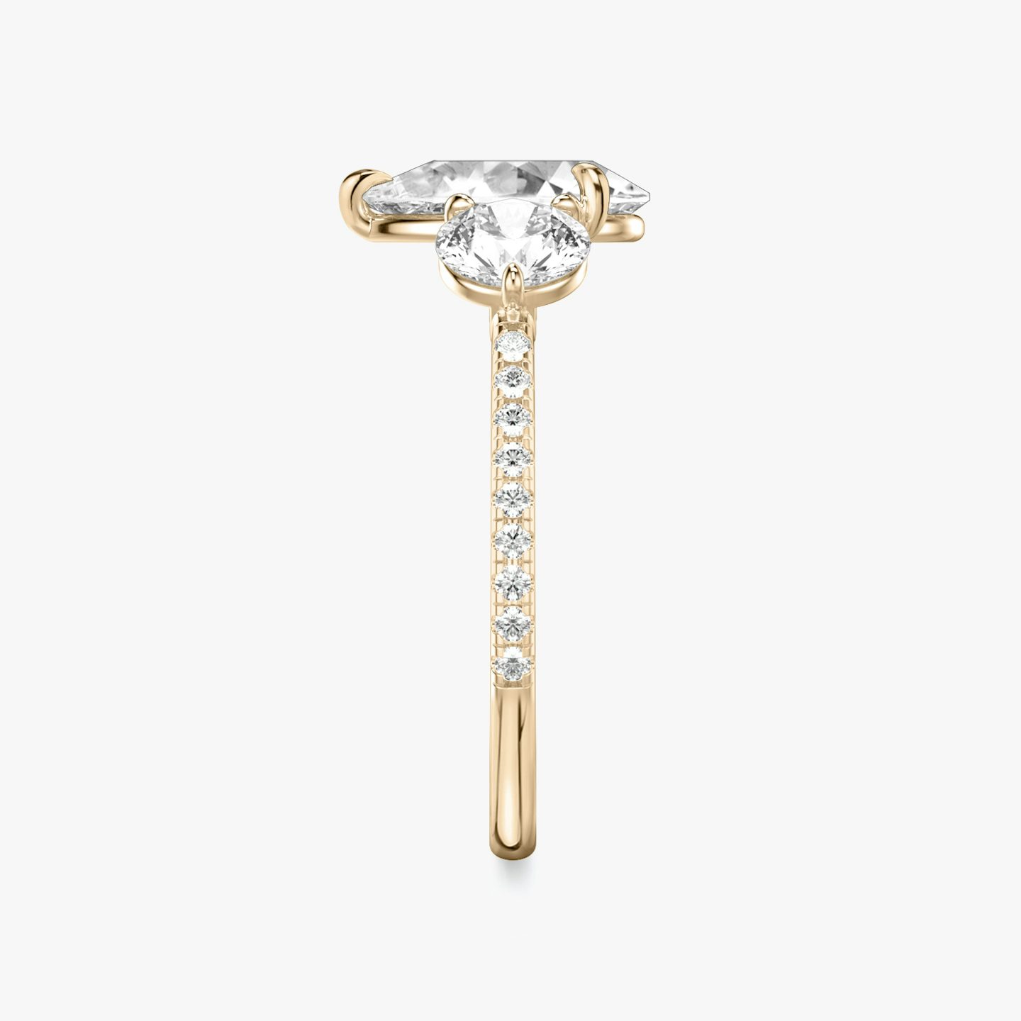 The Three Stone | Pear | 14k | 14k Rose Gold | Band: Pavé | Side stone carat: 1/2 | Side stone shape: Round Brilliant | Diamond orientation: vertical | Carat weight: See full inventory
