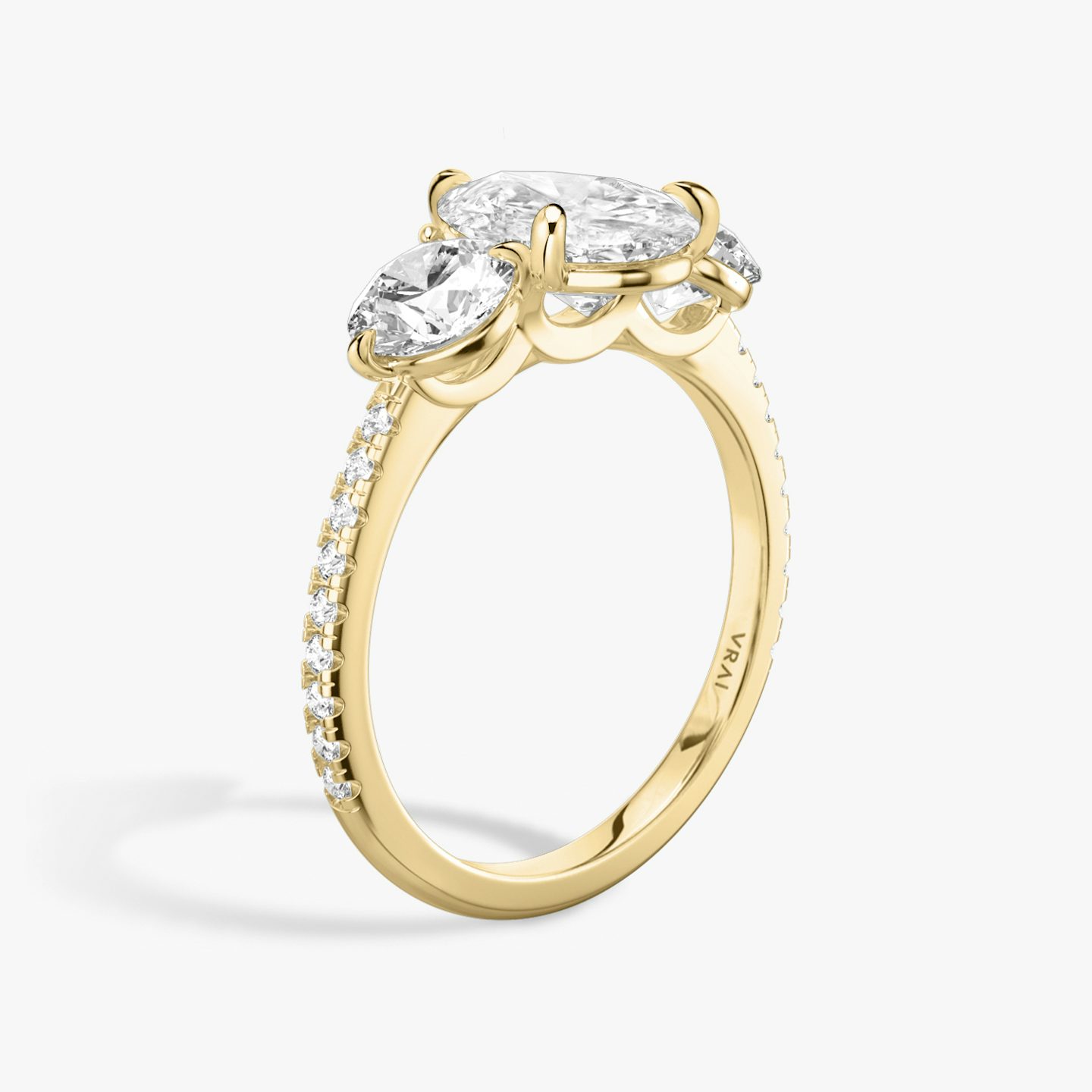 The Three Stone | Pear | 18k | 18k Yellow Gold | Band: Pavé | Side stone carat: 1/2 | Side stone shape: Round Brilliant | Diamond orientation: vertical | Carat weight: See full inventory