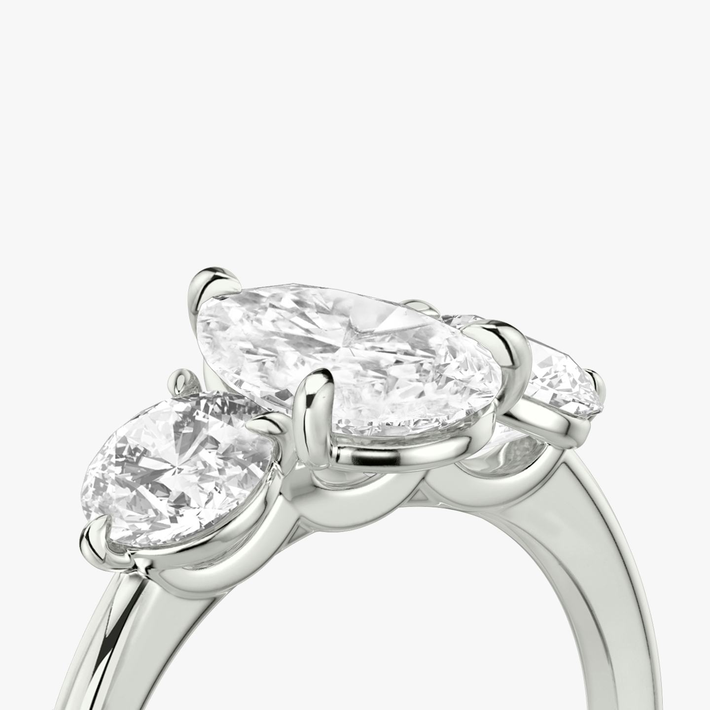 The Three Stone | Pear | 18k | 18k White Gold | Band: Plain | Side stone carat: 1/2 | Side stone shape: Round Brilliant | Diamond orientation: vertical | Carat weight: See full inventory