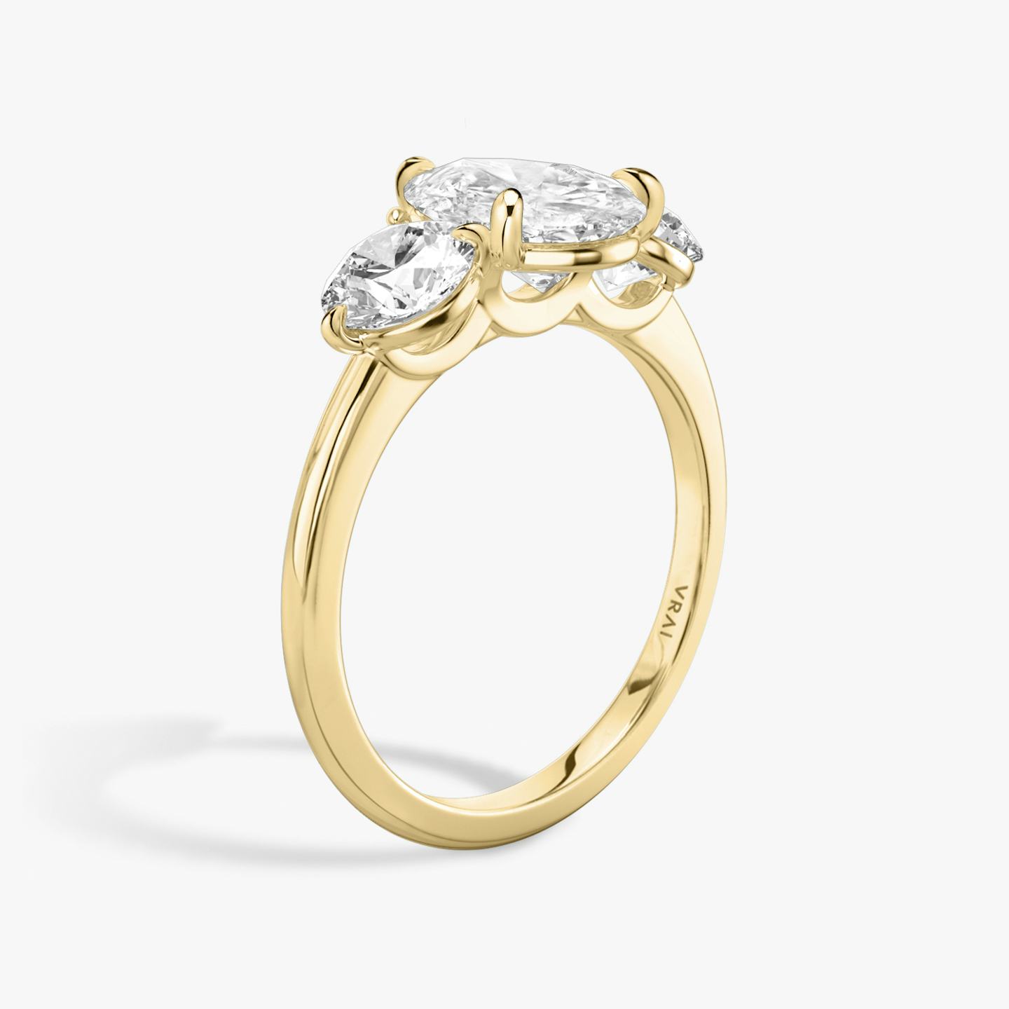 The Three Stone | Pear | 18k | 18k Yellow Gold | Band: Plain | Side stone carat: 1/2 | Side stone shape: Round Brilliant | Diamond orientation: vertical | Carat weight: See full inventory
