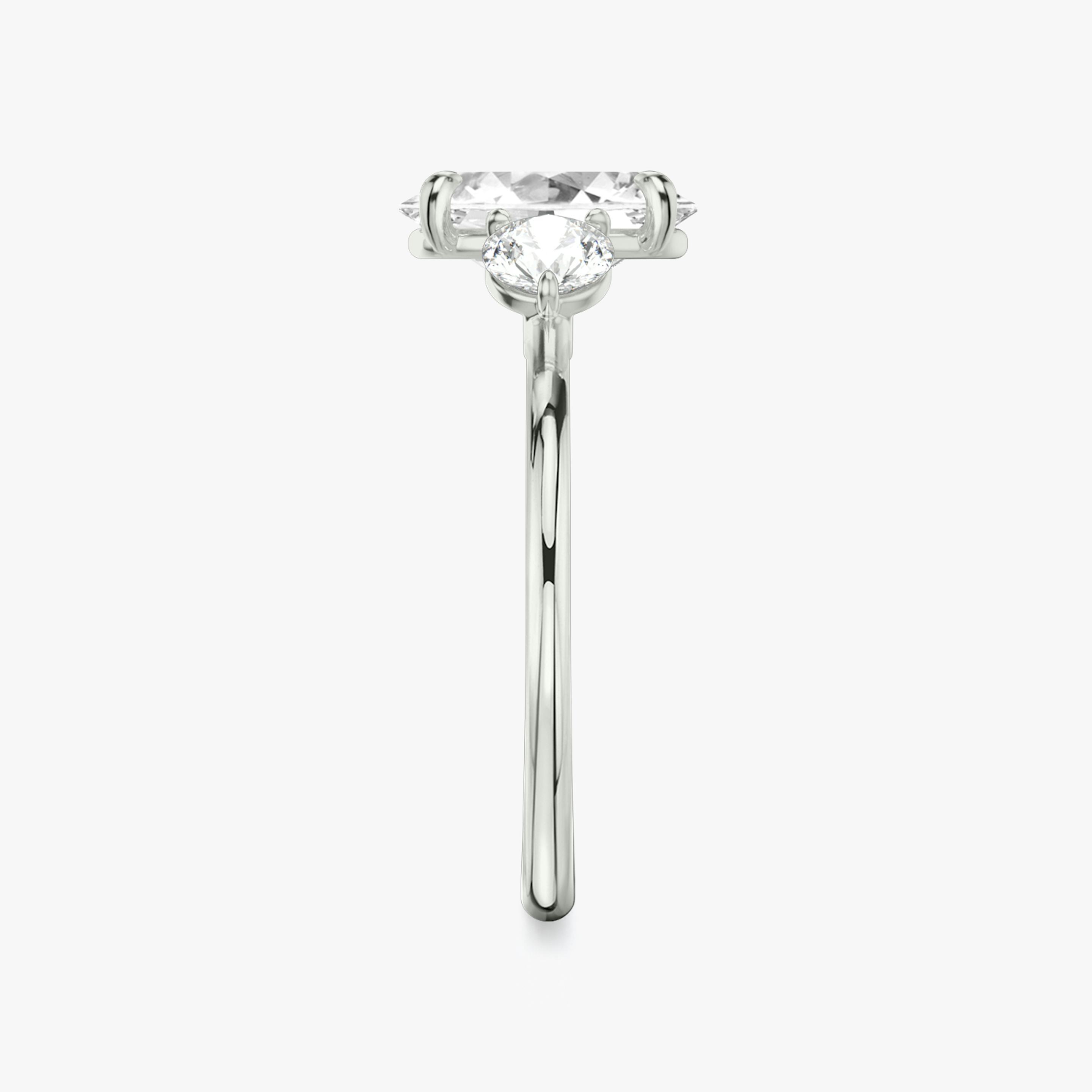 The Three Stone | Oval | 18k | 18k White Gold | Band: Plain | Side stone carat: 1/4 | Side stone shape: Round Brilliant | Diamond orientation: vertical | Carat weight: See full inventory